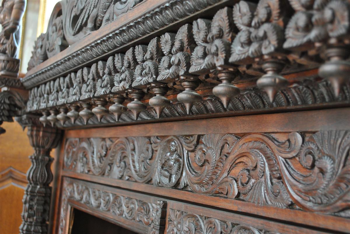 19th century Indian cupboard in solid rosewood very richly carved with animals and deities. This set was imported into France from Bombay in 1908. The quality of sculpture is simply remarkable. The dimensions of this cupboard should be checked as