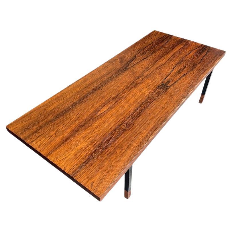 A very sleek Danish 1960s coffee table with black metal frame and legs