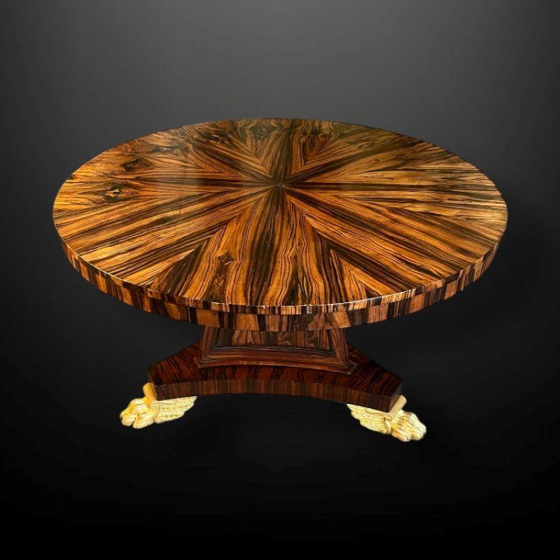 Gilt A very striking Regency Coromandel Centre Table with gilt paw feet. For Sale