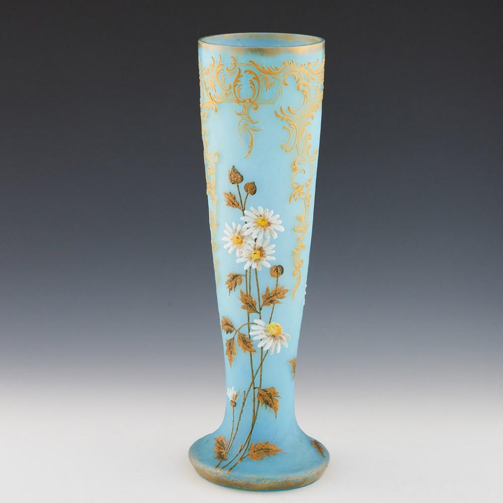 A Very Tall Legras Enamelled Cameo Vase, c1900

Additional information:
Date : c1900
Origin : Verreries de Saint-Denis, Paris
Bowl Features : High relief enamelled Ox-eye daisies and gilded leaves. High relief yellow c-scoll gold pendants with clear