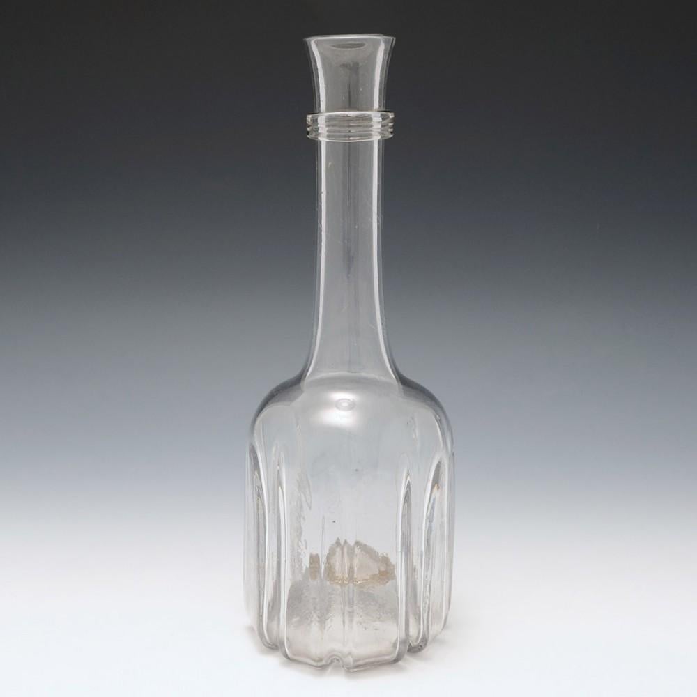 A Very Tall Modified Cruciform Decanter Bottle, c1740

Cruciform decanters were never stoppered with glass, they were corked. They may also have been intended for sparkling wines and cider. The latter may undergo a secondary malolactic fermentation