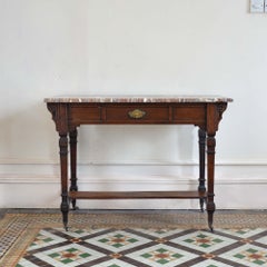 A Victorian Aesthetic Movement marble topped table