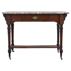 A Victorian Aesthetic Movement marble topped table