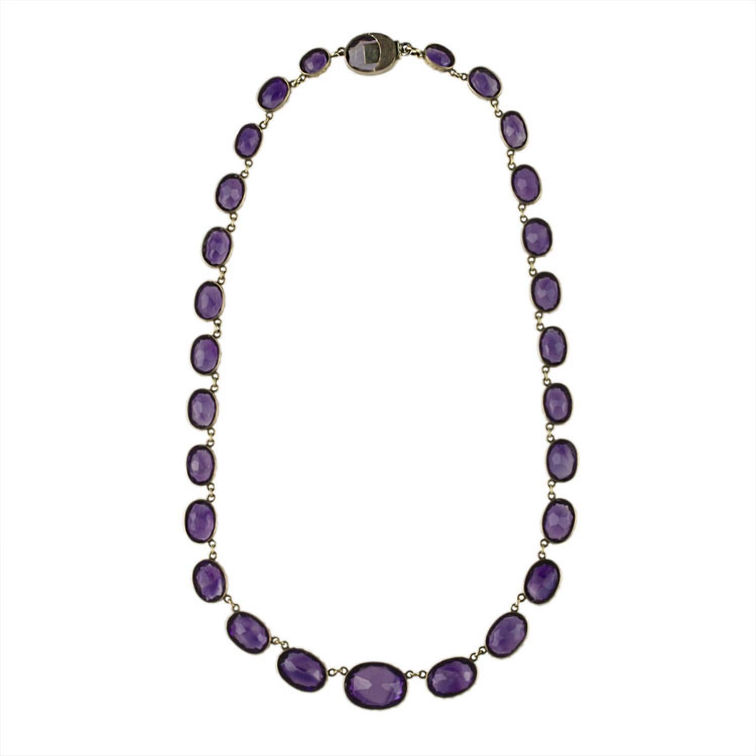 A Victorian amethyst riviere necklace, the twenty eight graduated oval mixed-cut amethysts each set within a yellow gold collet, measuring approximately 9.1 x 6.5 x 3.8mm, to 17.4 x 12.6 x 8.3mm, to a hidden snap clasp, circa 1860,measuring