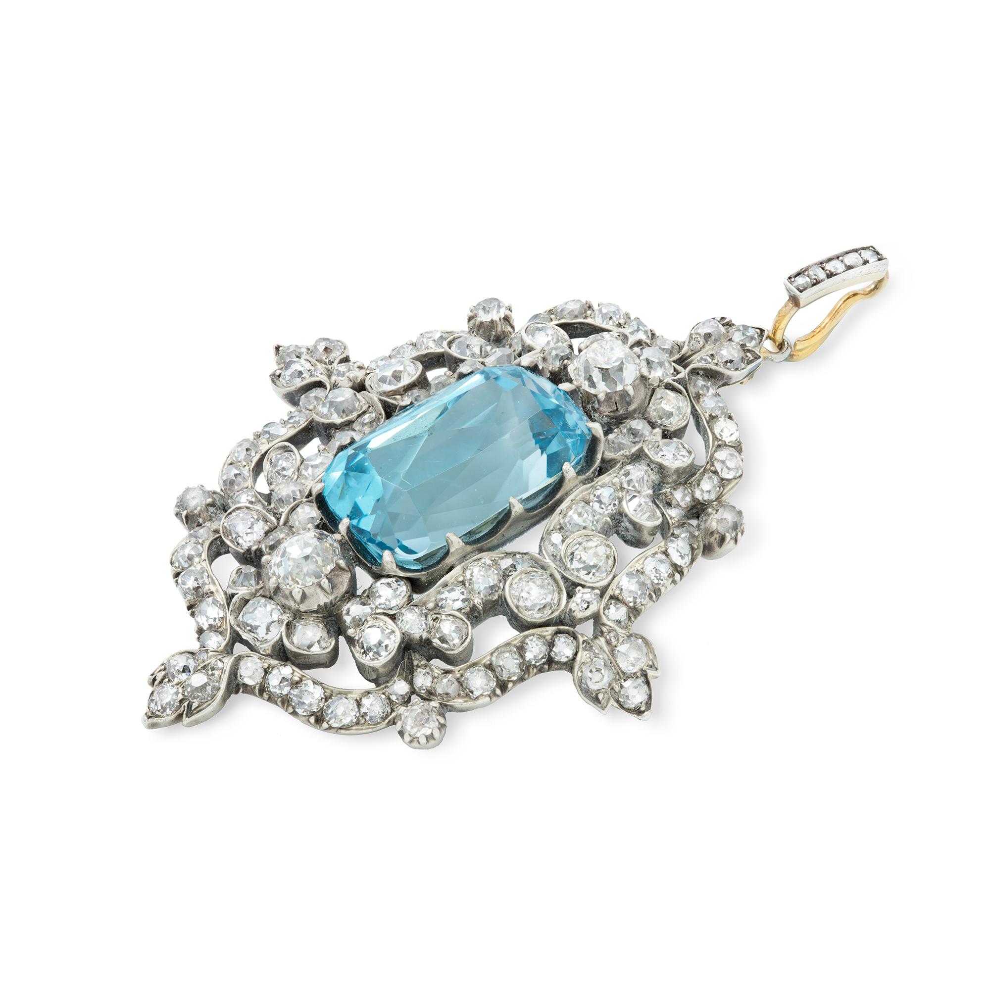 An Victorian aquamarine and diamond pendant/ brooch, the cushion shaped aquamarine weighing approximately 7.5 carats, surrounded by old-brilliant-cut diamonds, weighing approximately 6 carats, all set in silver to yellow gold mount, with diamond-set