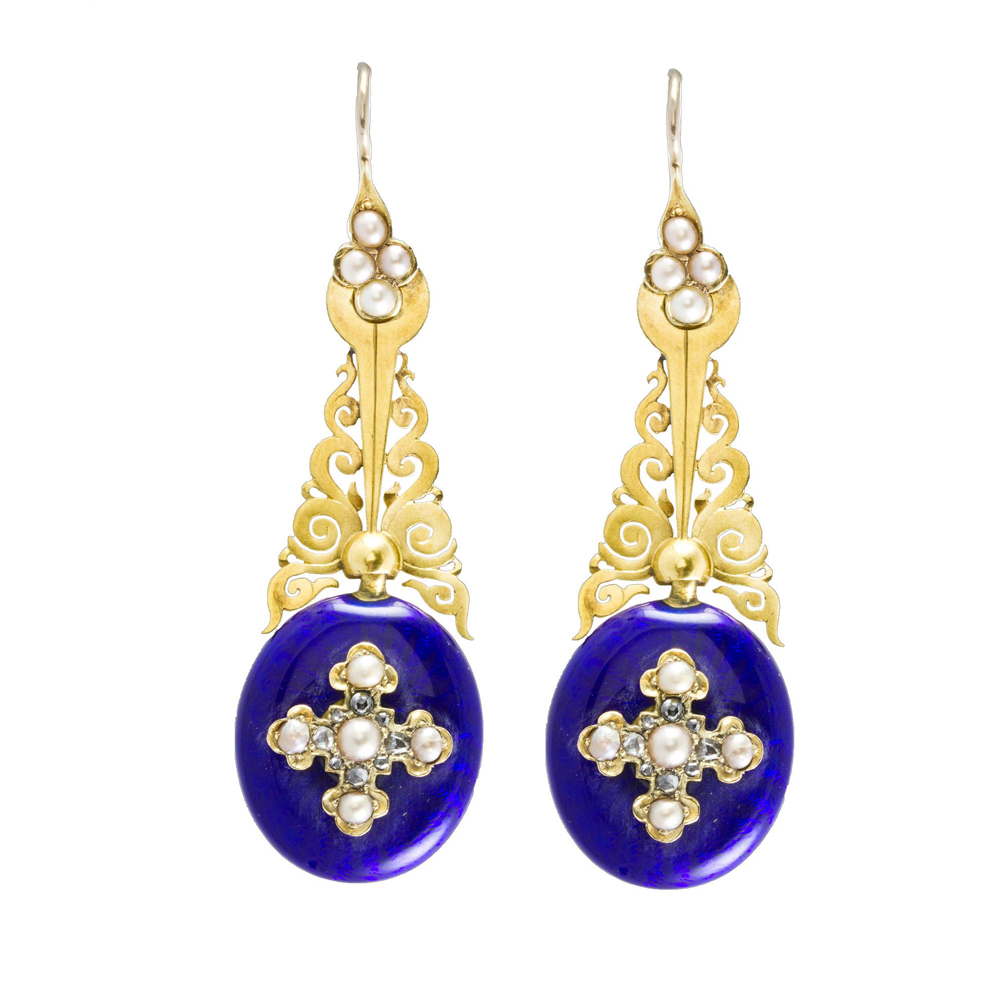 A Victorian blue enamel pair of earrings and locket, the oval drop set with pearl and diamond-set stylised Byzantine cross beneath gold scrolling runs, with matching locket, circa 1860, measuring approximately 3.6cm, gross weight 37.1 grams.

This