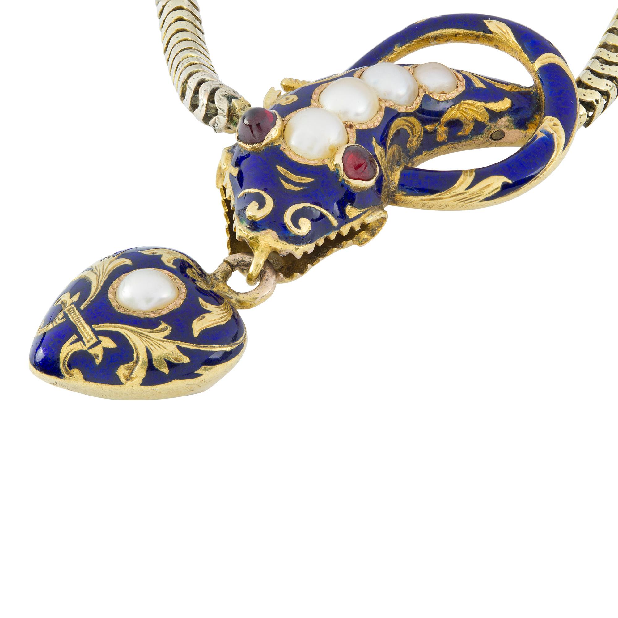 A Victorian blue enamel serpent necklace, the Bristol blue enamelled serpent head with a central row of graduated half pearls, cabochon ruby eyes and a decorative coiled tail, suspending a heart shaped pendant drop from its mouth, all to a yellow