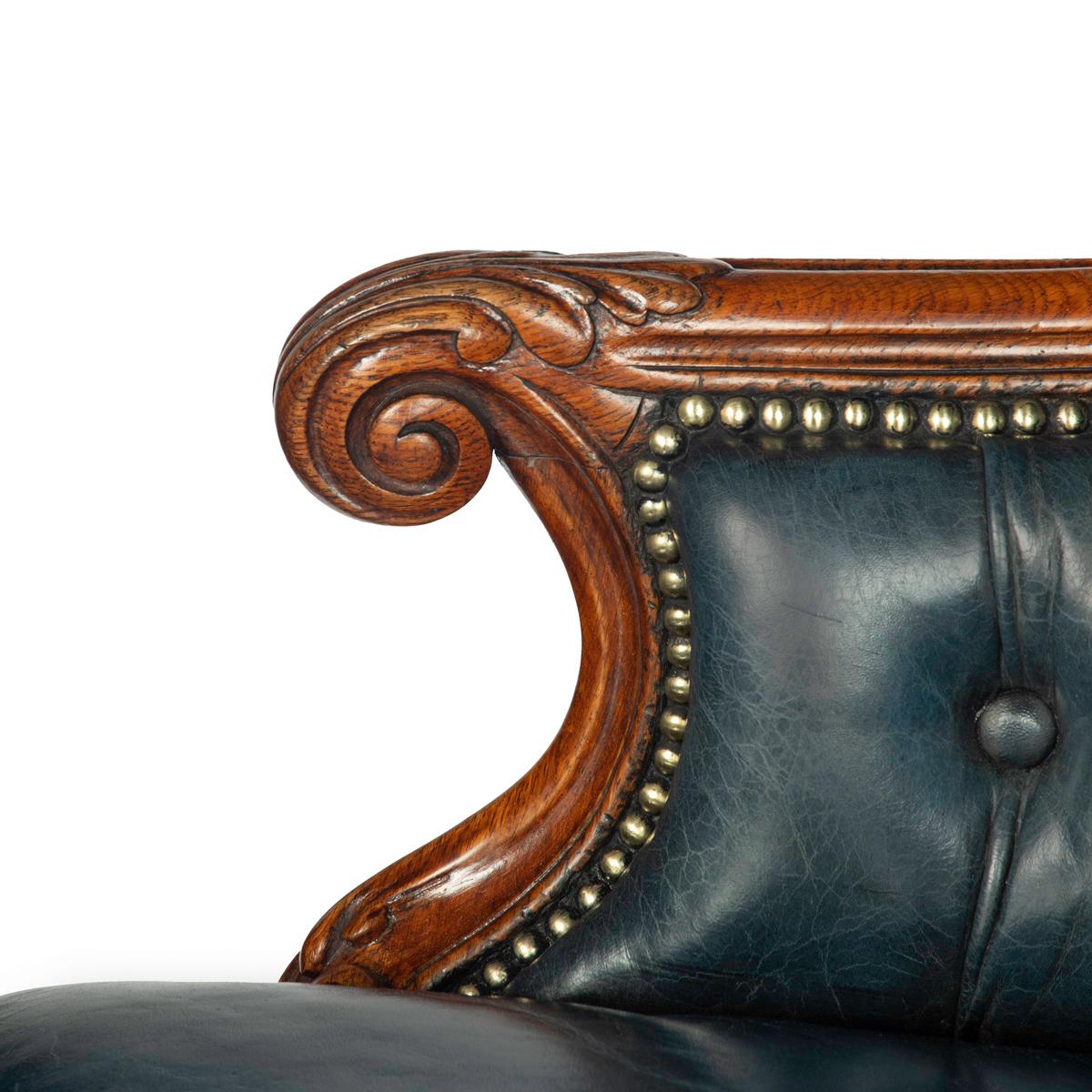 A Victorian blue leather oak library chair For Sale 1