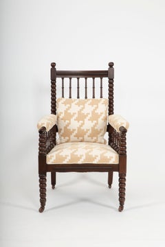 A Victorian Bobbin-Turned Armchair in Carved Oak