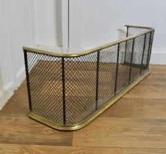A Victorian Brass and Iron Fender or Fire Guard   A Victorian antique fire guard