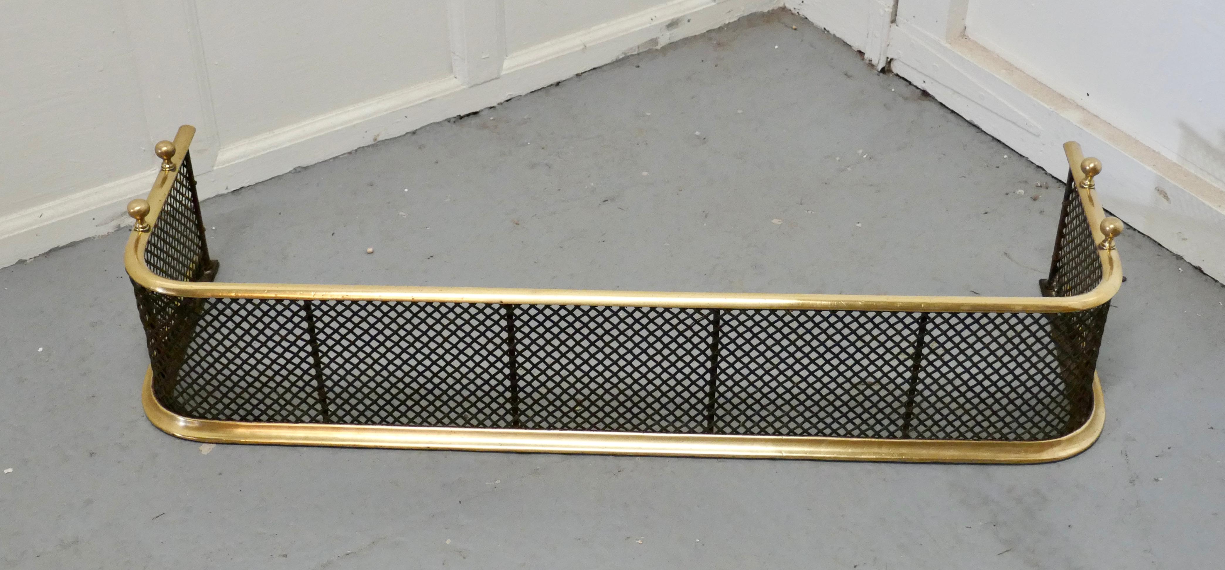 A Victorian brass and iron fender or fireguard
 
A Victorian antique fire guard, the fender has heavy mesh with brass rails top and bottom, decorated with brass knobs on the top, the fender is in good all round condition 
The fender is 9” high,