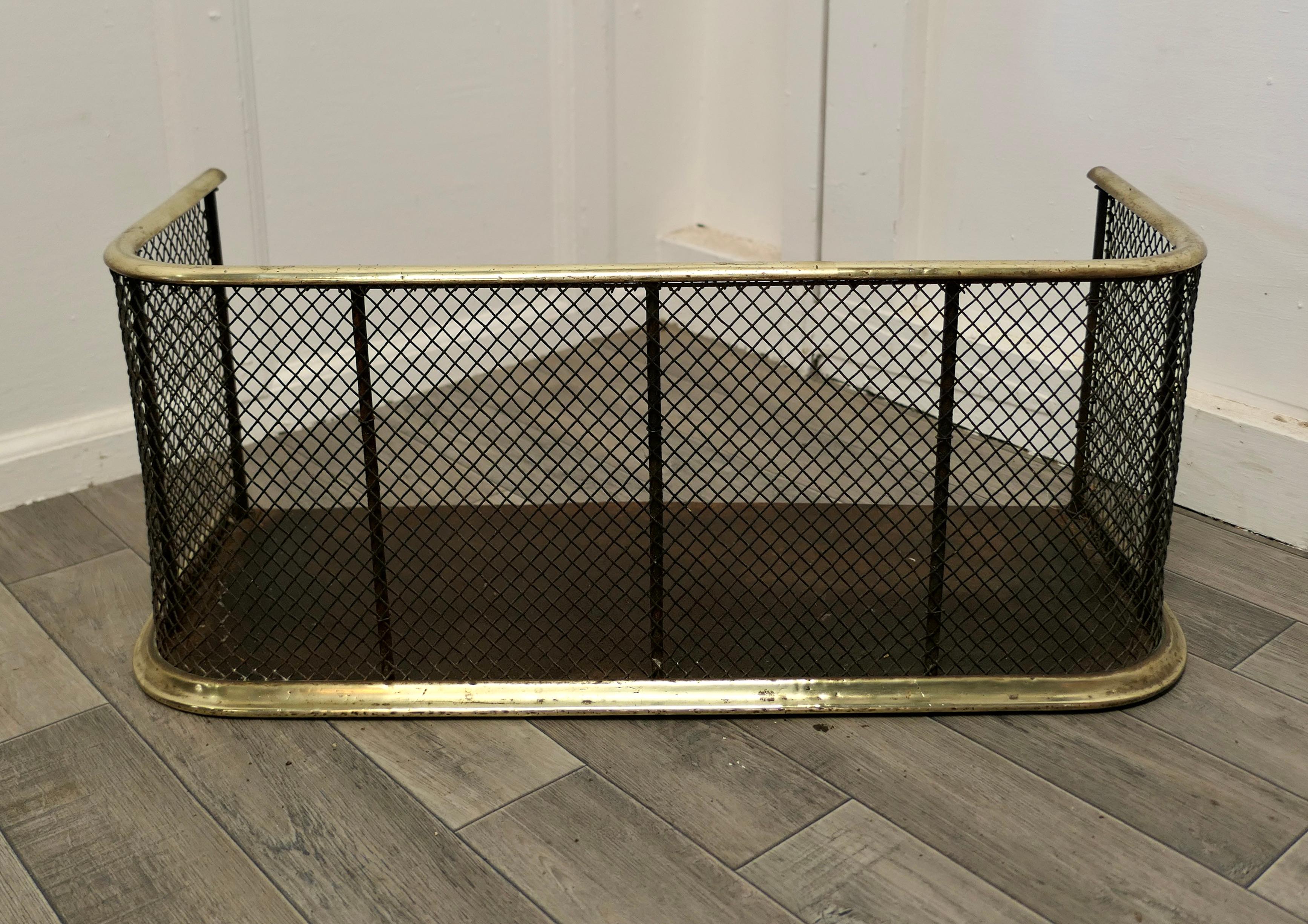 A Victorian brass and iron fender or fireguard.
 
A Victorian antique fire guard, the fender has heavy mesh with brass rails top and bottom and the fender is in good all round condition.
Measures: the fender is 12” high, 12” deep and 429” long.
 