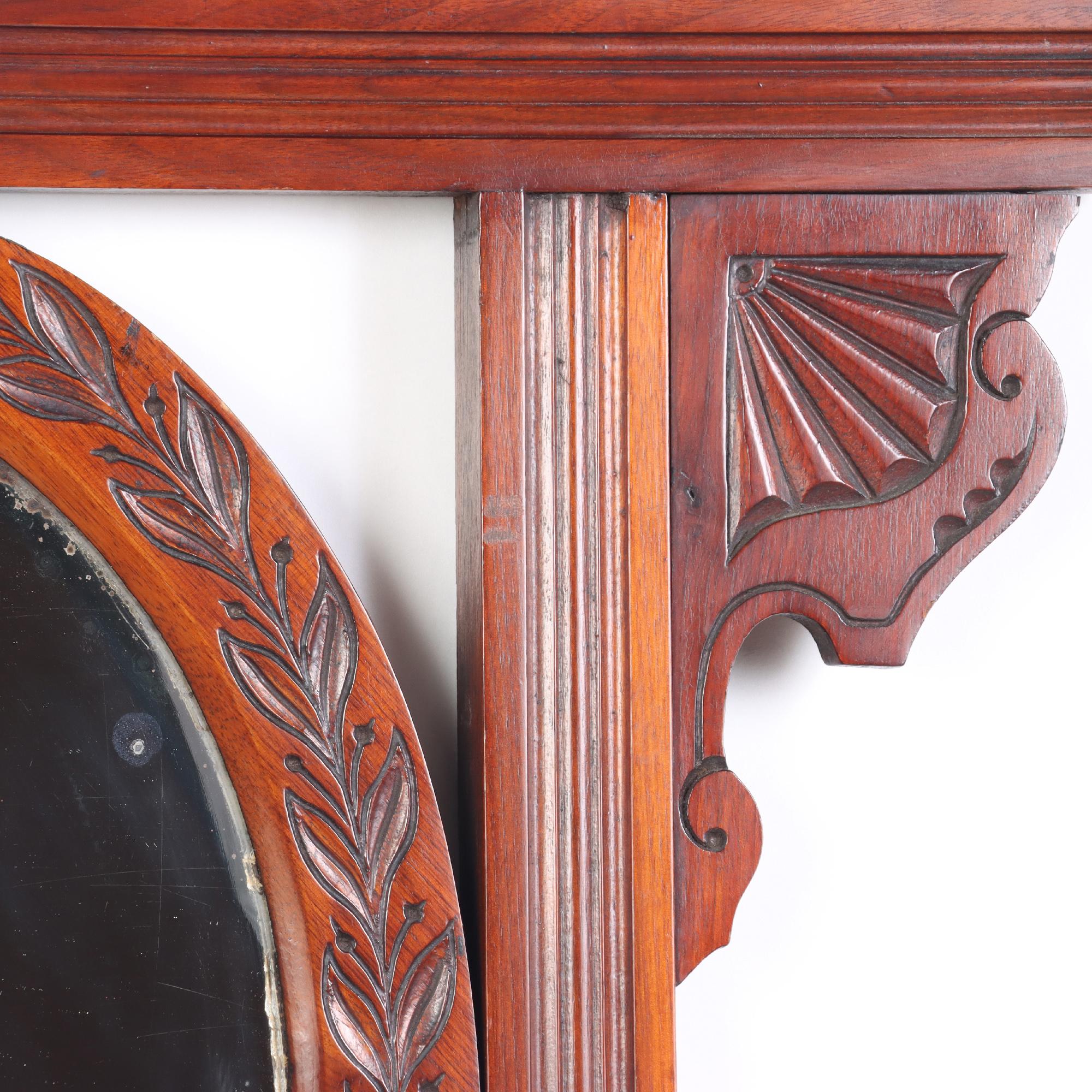 European Victorian Carved Mahogany Wall Mirror with Shaped Beveled Mirror circa 1880 For Sale