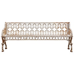 A Victorian Cast Iron and White Painted Bench A Victorian Cast Iron and White Painted Bench