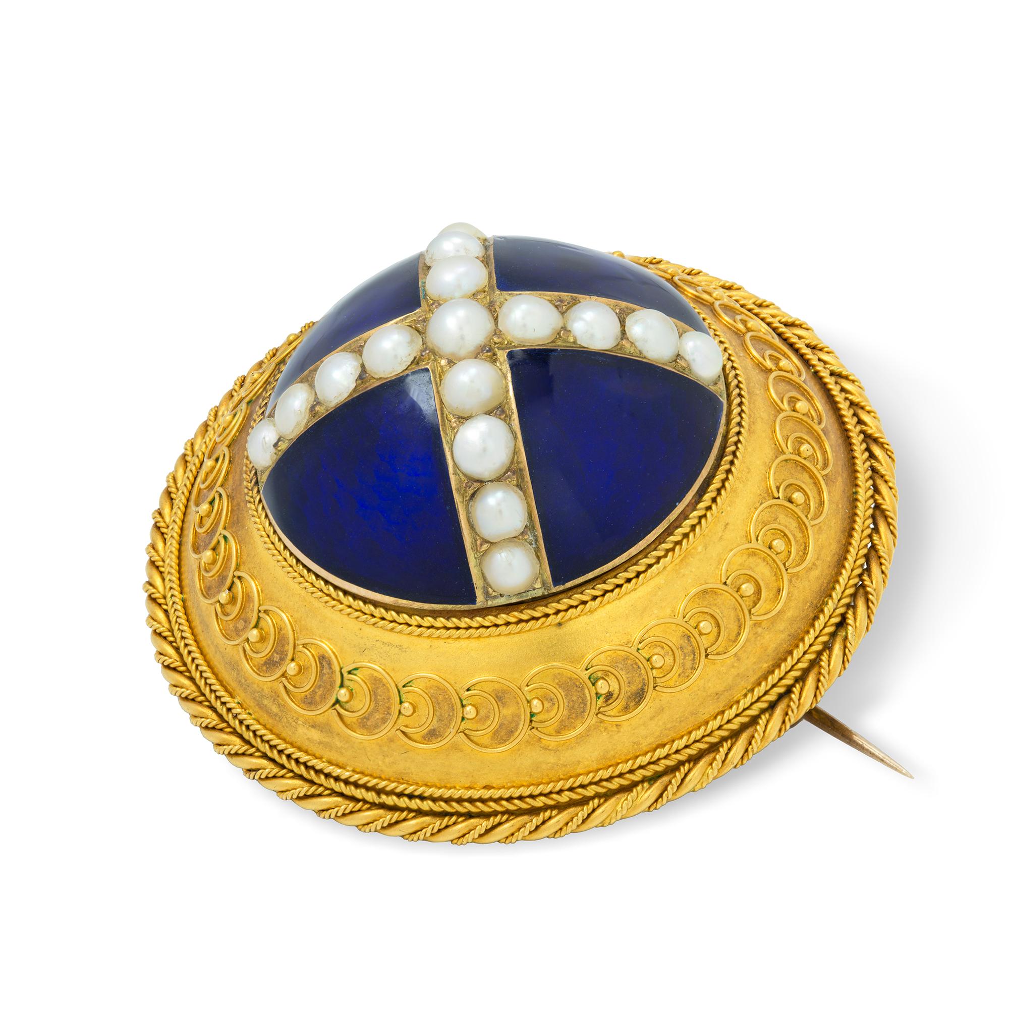 A Victorian circular blue enamel, pearl and gold brooch, the seventeen pearls set in the form of a cross to a blue enamelled background, surrounded by a yellow gold border with fine rope-work and wire decorations, with glass covered compartment to