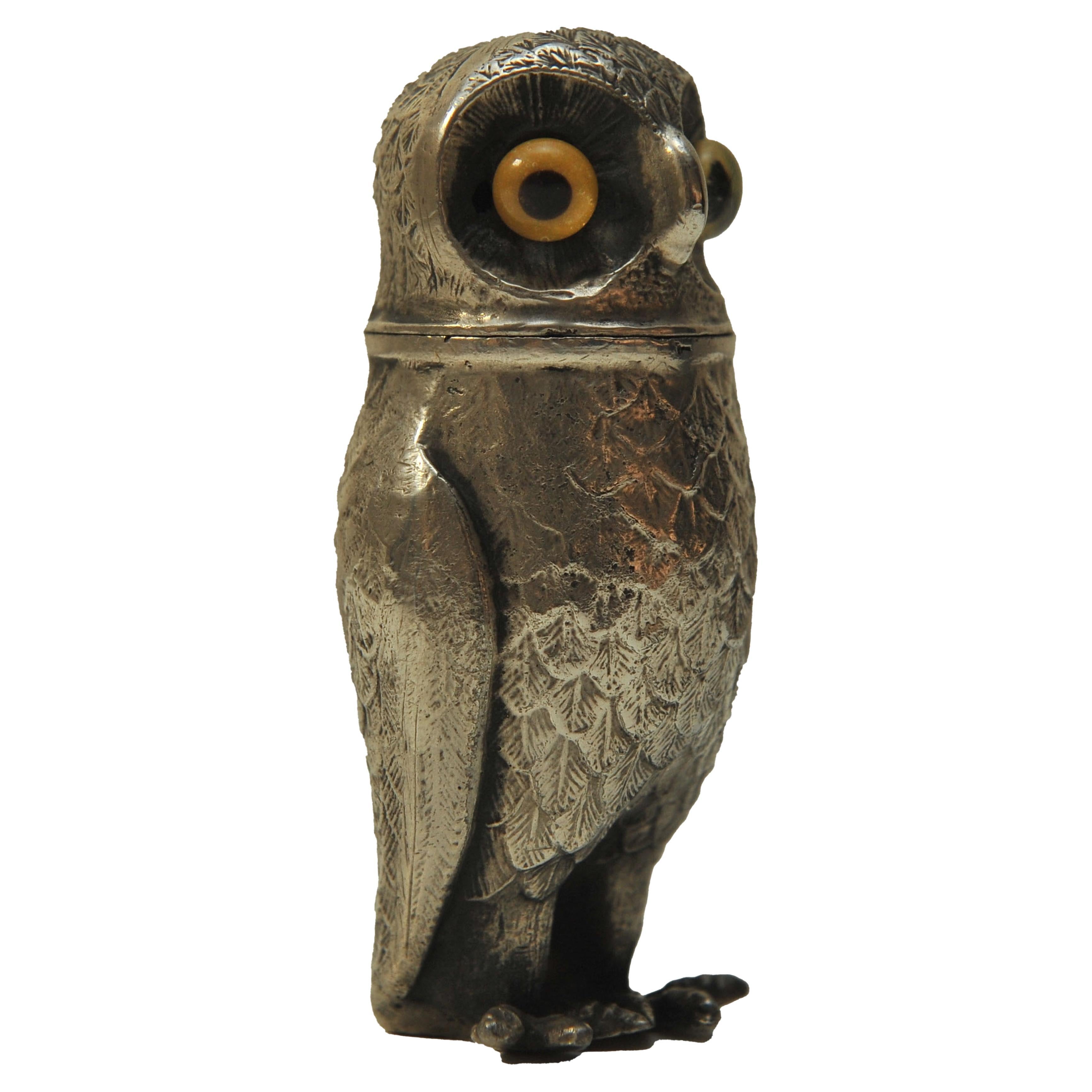 A Continental Silver Pepper Peperette In The Form of An Owl With Glass Eyes.

A lovely 19th century (Victorian era) German silver pepperette or pounce pot (used to contain fine sand to shake on to handwritten ink documents to dry them) in the form