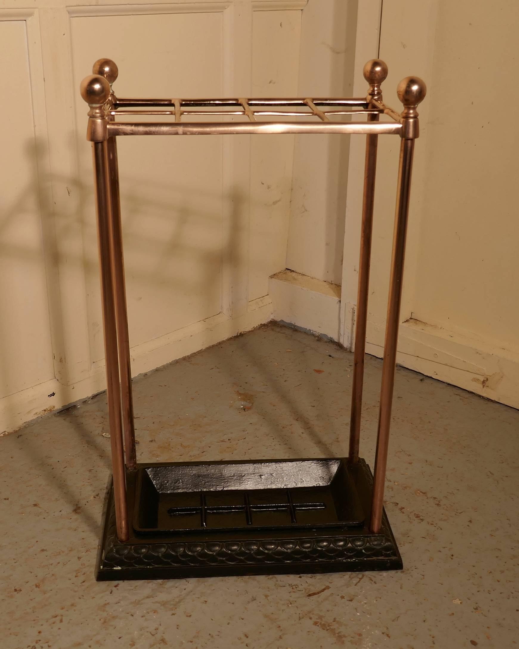 A Victorian copper and cast Iron walking stick stand or umbrella stand

A charming piece, the stand has a copper top divided into eight sections to hold either walking sticks or umbrellas, the heavy iron base holds the drip tray
The stand is 26”
