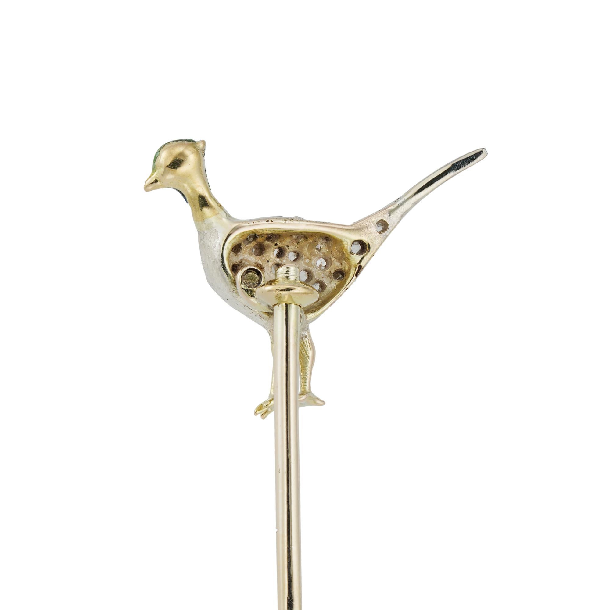 A Victorian diamond and enamel pheasant stick pin, the head of the pin depicting a pheasant with rose-cut diamonds set to silver and an enamelled head, total diamond weight approximately 0.15 carats, the pheasant measuring 16.9 x 10mm, set to an