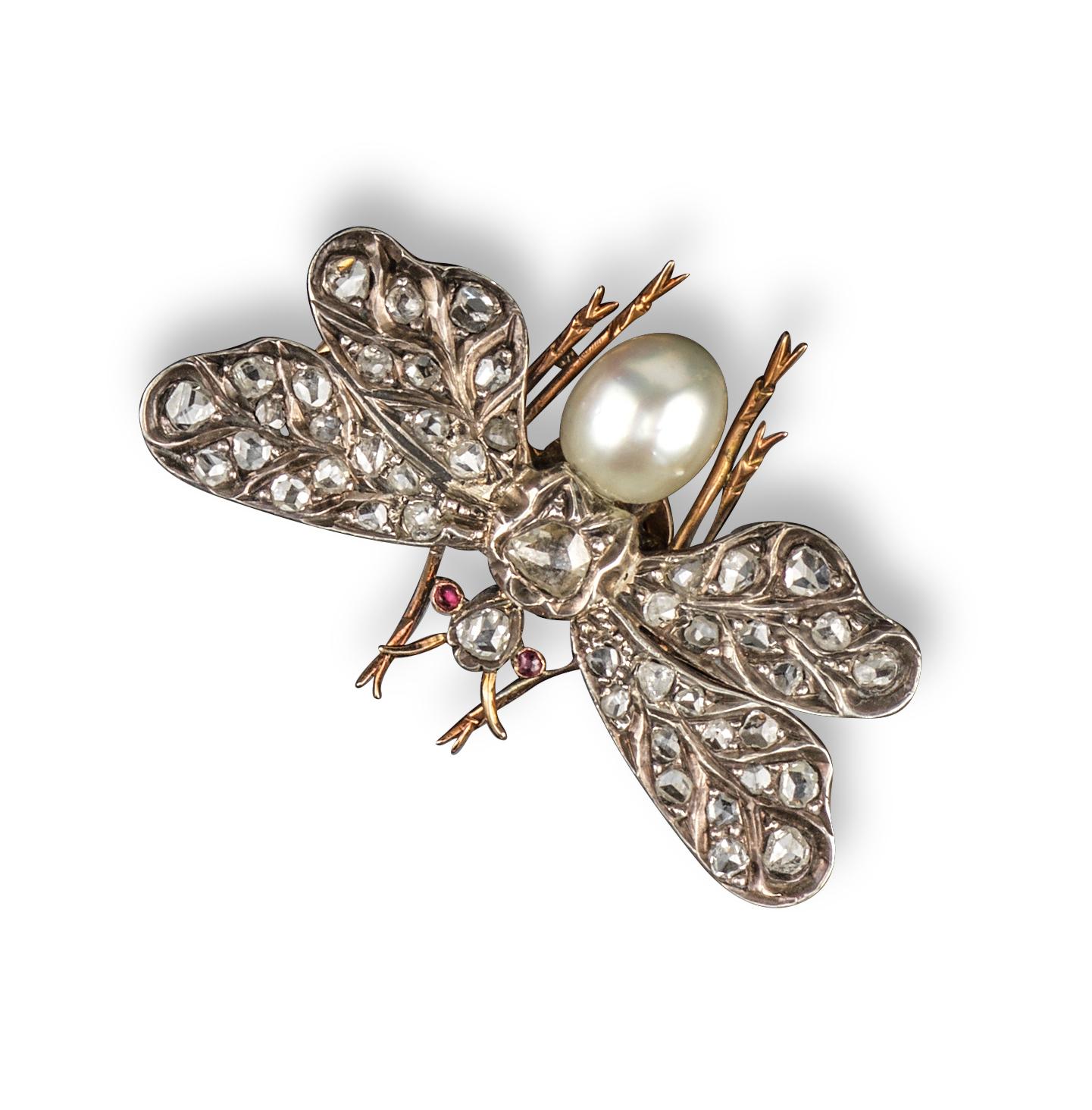 The wings pave-set with rose cut diamonds, the body formed from a pearl in silver and gold, 3.8cm wide