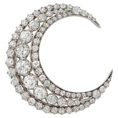 A Victorian diamond set crescent brooch
