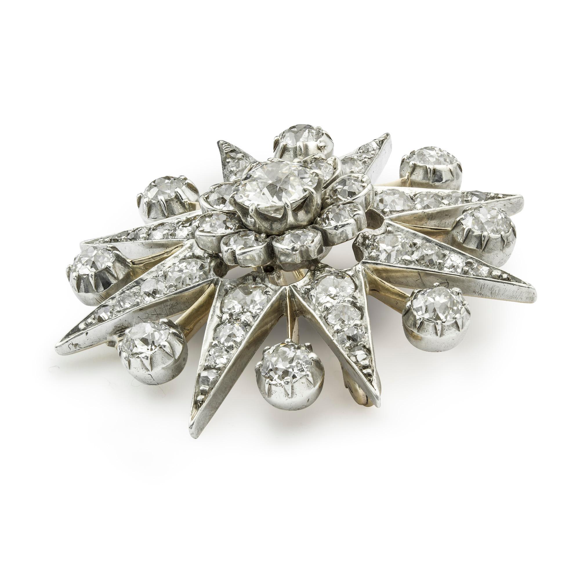 Eine viktorianische diamantbesetzte Sternbrosche, in der Mitte ein Diamant im alten europäischen Schliff mit einem geschätzten Gewicht von 1,5 Karat, umgeben von  acht Diamanten im Altschliff in Form einer Blumengruppe in einem diamantbesetzten