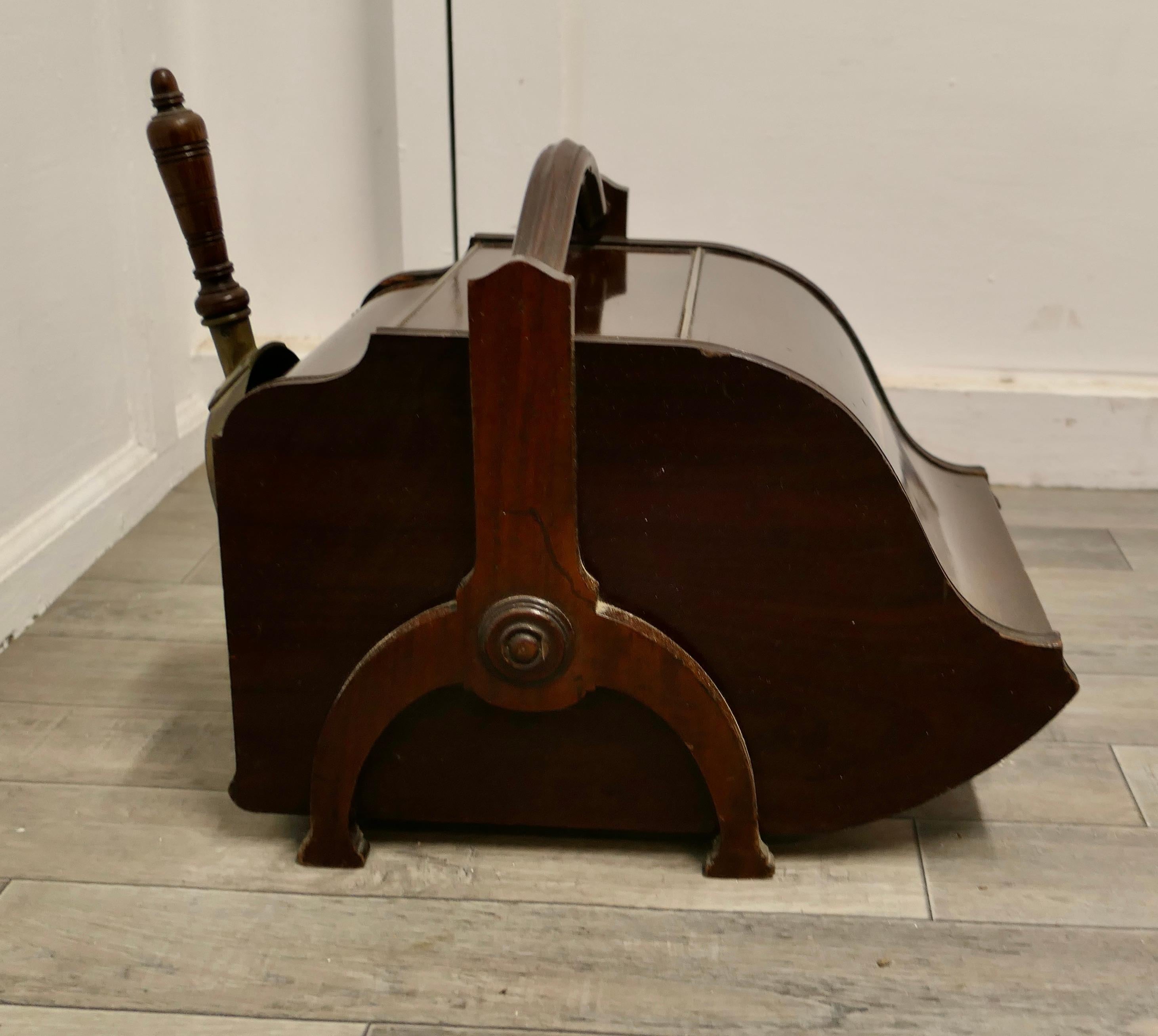 A Victorian Double Ended Coal Box with Liner and Shovel

A charming piece of useful Victorian furniture, the box has a piano shaped opening front it also opens at the back with a shovel and holder and a metal liner which is removable from the back