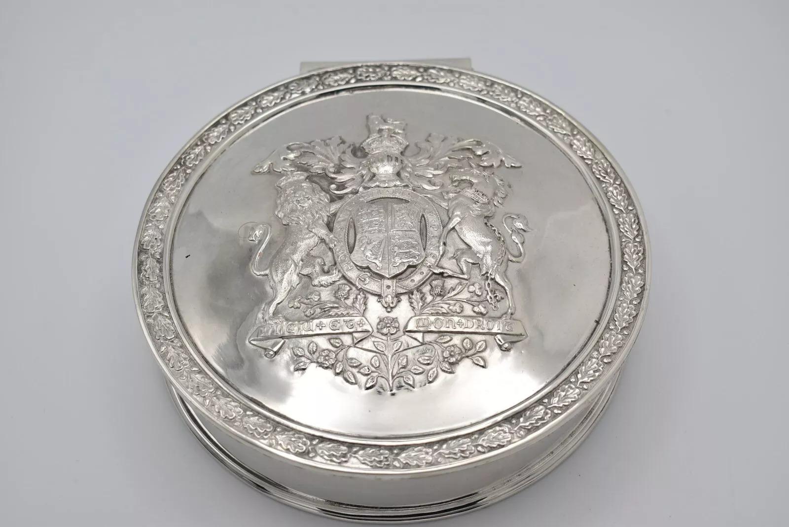 Silver Metal Elkington & Co George IV Emblem Round Hinged Lid Box
Dimensions:
17.5 x 17.5 x 4 cm

A Victorian electroplated seal box, by Elkington and Co, circular form, the hinged cover embossed with the Royal Coat of Arms, within an oak leaf