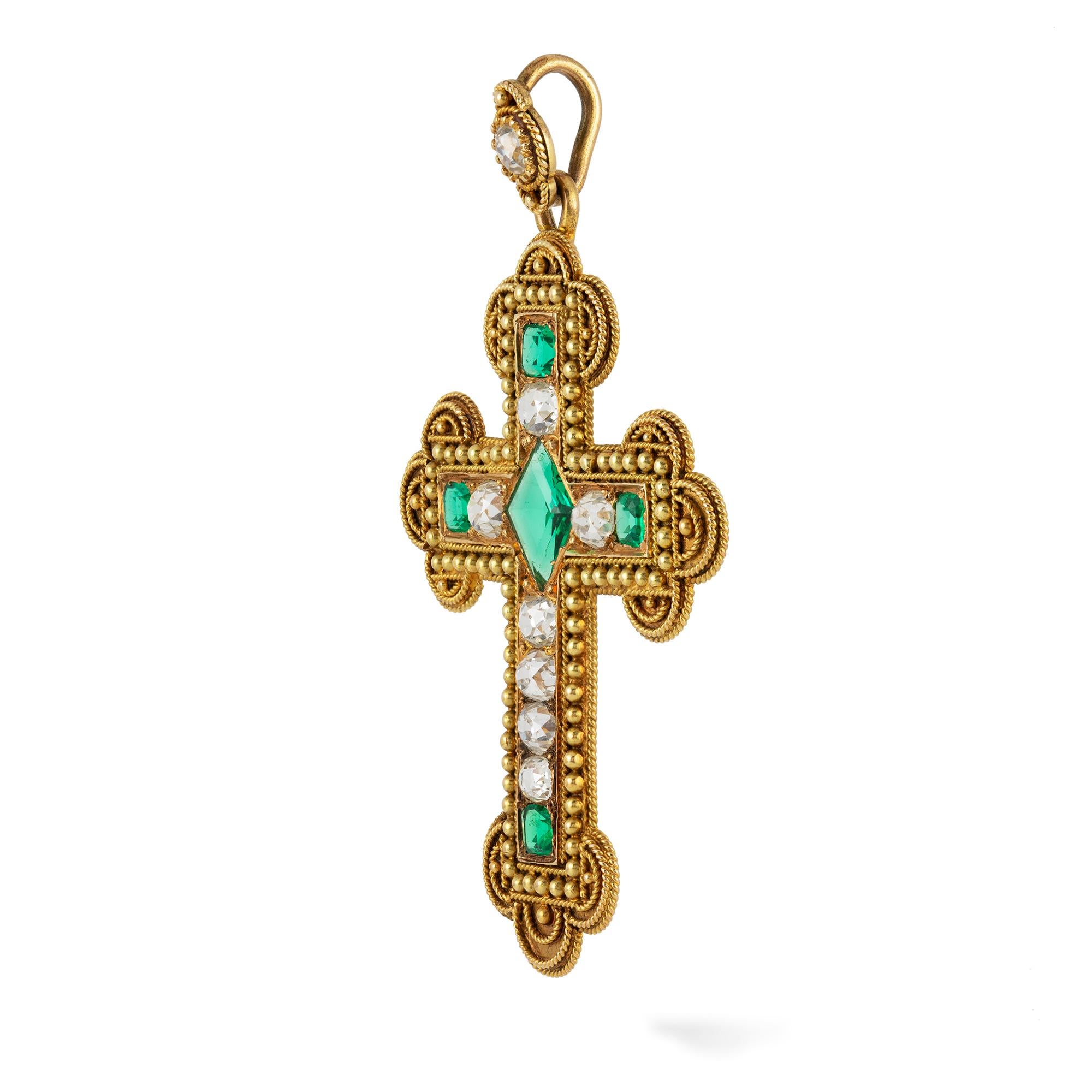 A Victorian Archaeological Revival emerald and diamond trefoil cross pendant, of archaeological revival style, to the centre a kite-shaped emerald estimated to weigh 1 carat, the arms set with old-cut diamonds and cushion-shaped emeralds, surrounded