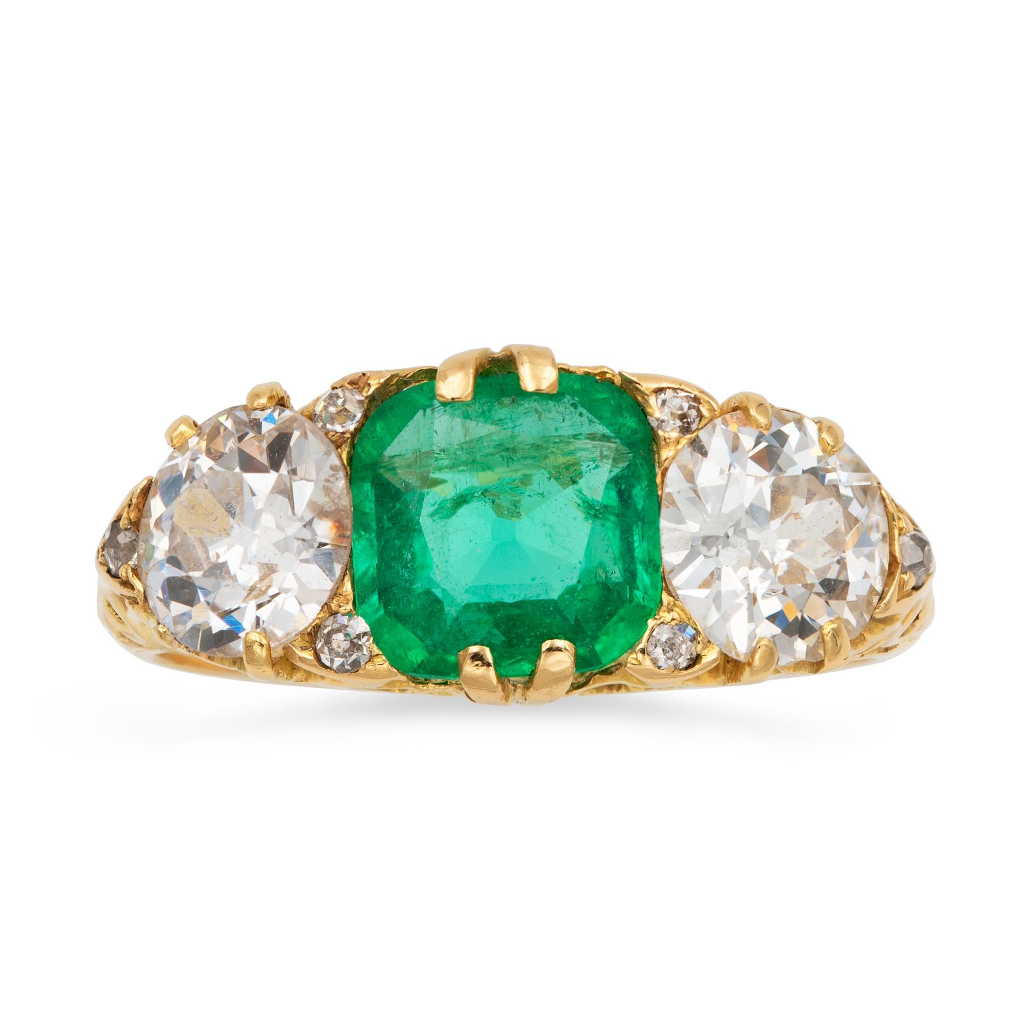 emerald three stone ring