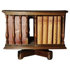 A Victorian English Antique Tabletop Revolving Bookcase With Turned Supports
