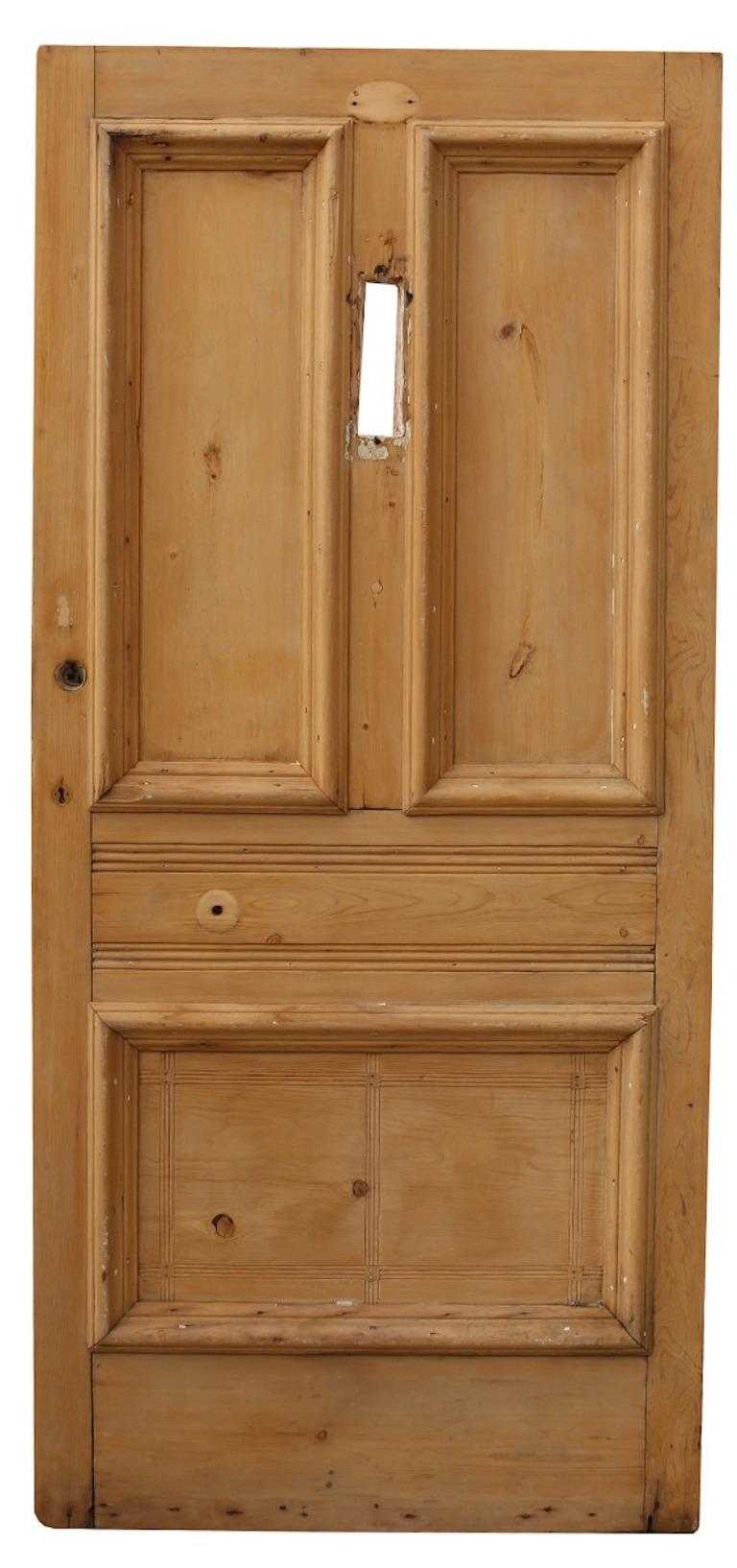 A reclaimed exterior door made from pine, with a stripped and sanded finish.