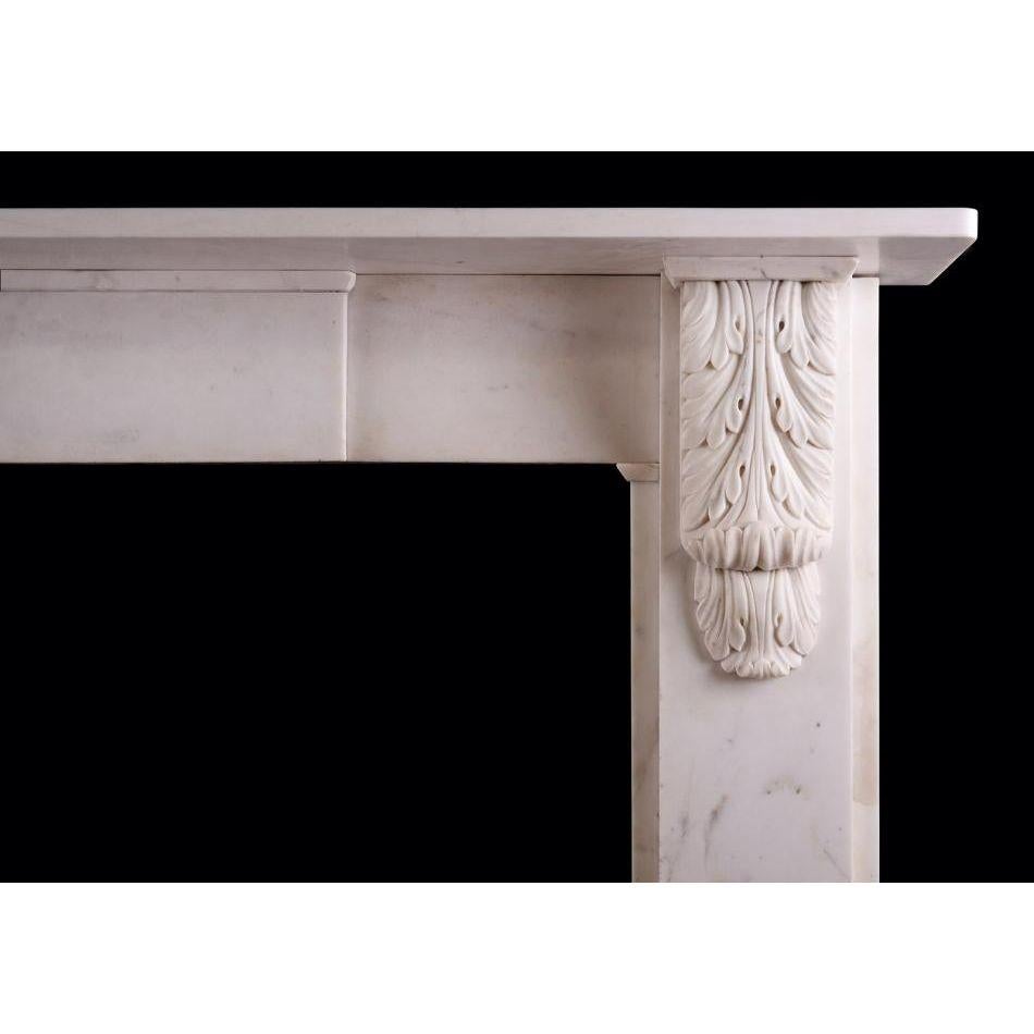 A Victorian fireplace in Statuary white marble. The plain jambs surmounted by brackets featuring carved acanthus leaves. The frieze with plain centre blocking, with plain shelf above. Mid 19th century, with later additions.    

Additional