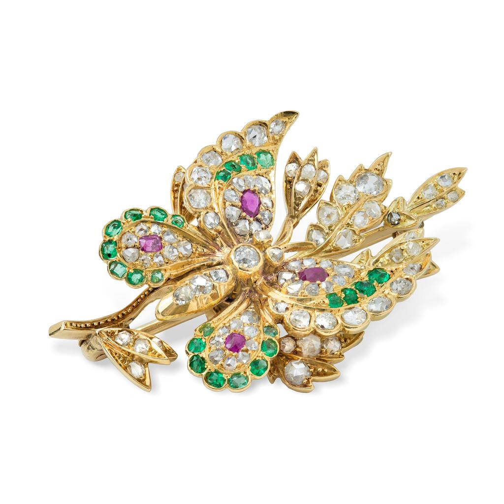A Victorian gem-set butterfly brooch, the body set with old-cut diamonds, the wings embellished with rose and old-cut diamonds, emeralds and rubies, perched on a branch with rose-cut diamond-set leaves, all mounted in yellow gold, the detachable