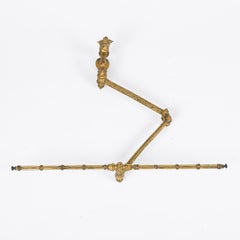 A Victorian gilt brass tapestry banner hanger