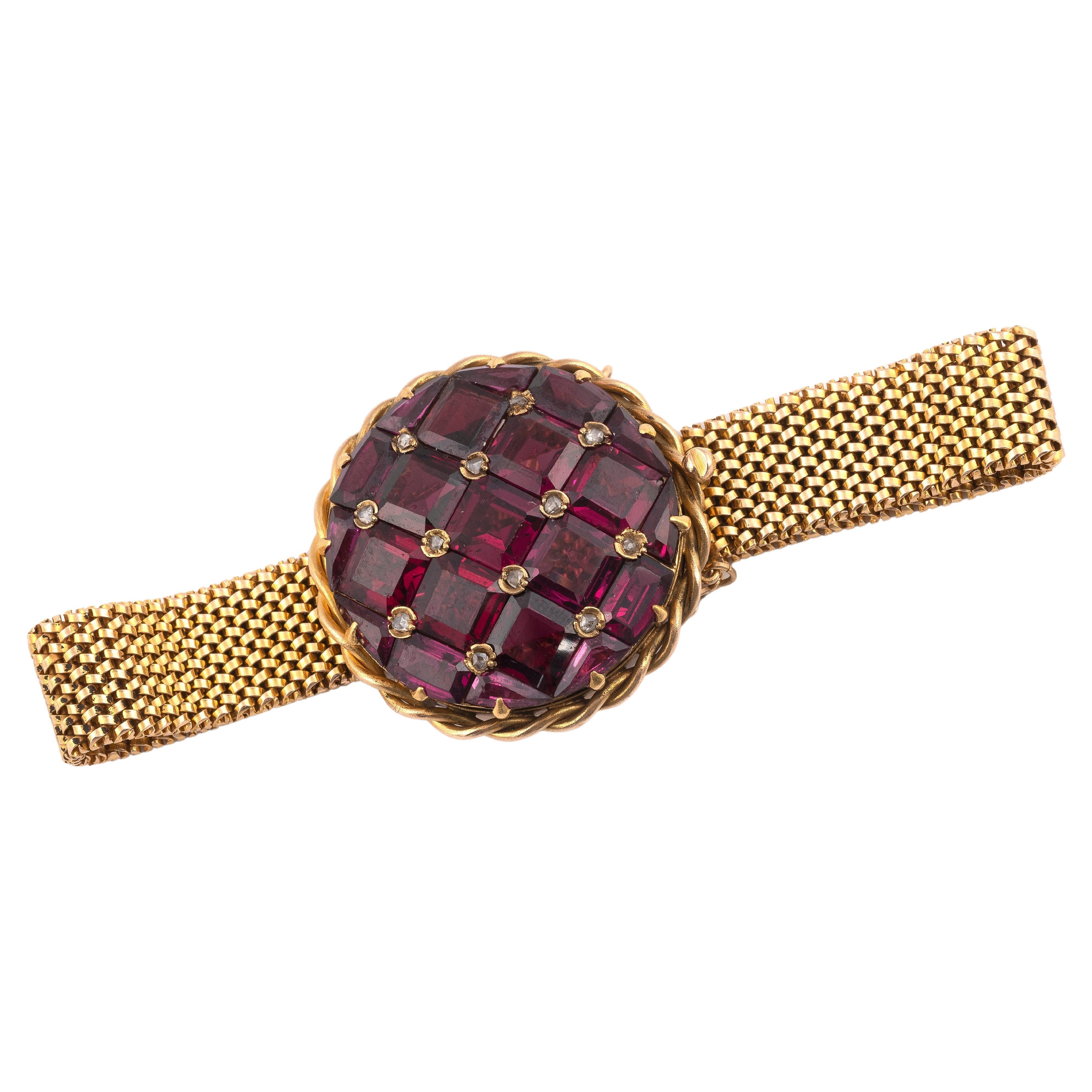 The bracelet centred with a square cut  amethyst and old-cut diamond, in original fitted case.
The central is diameter 30mm
Lenght: 18cm
Weight: 35.42gr.