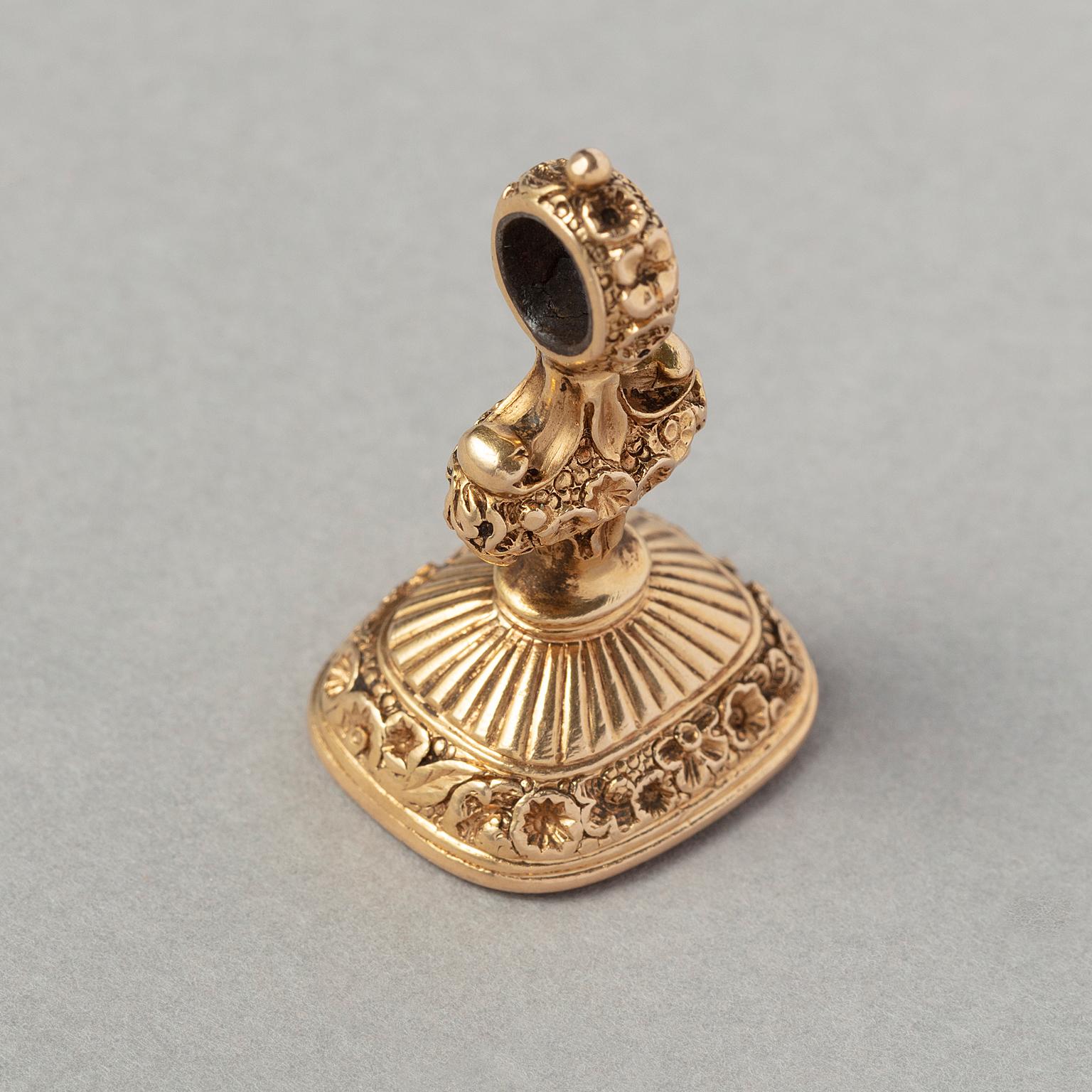 Uncut A Victorian Gold and Carnelian Seal with a Horse Crest