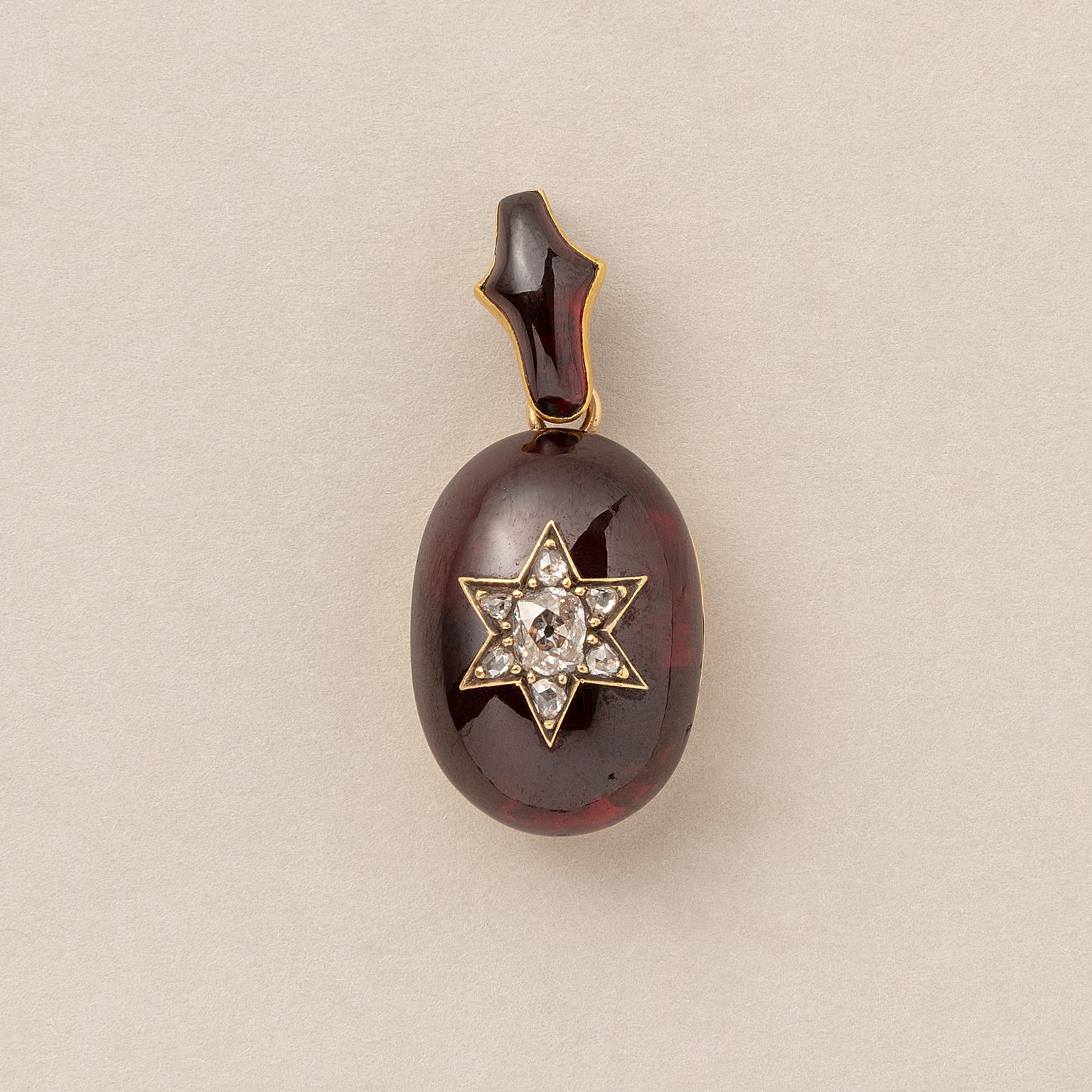 Women's or Men's A Victorian Gold and Garnet Pendant with a Diamond Star For Sale