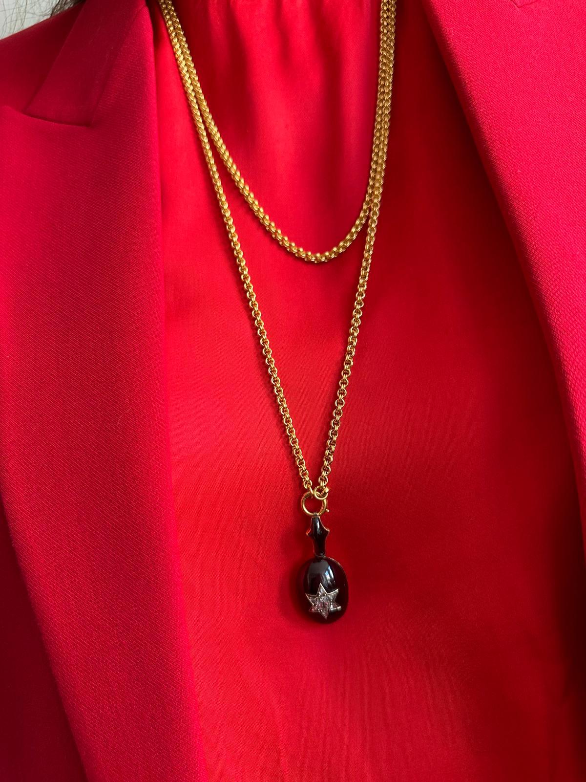 A Victorian Gold and Garnet Pendant with a Diamond Star For Sale 1