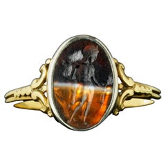 A Victorian gold and silver ring set with a Roman banded agate intaglio. Mercury