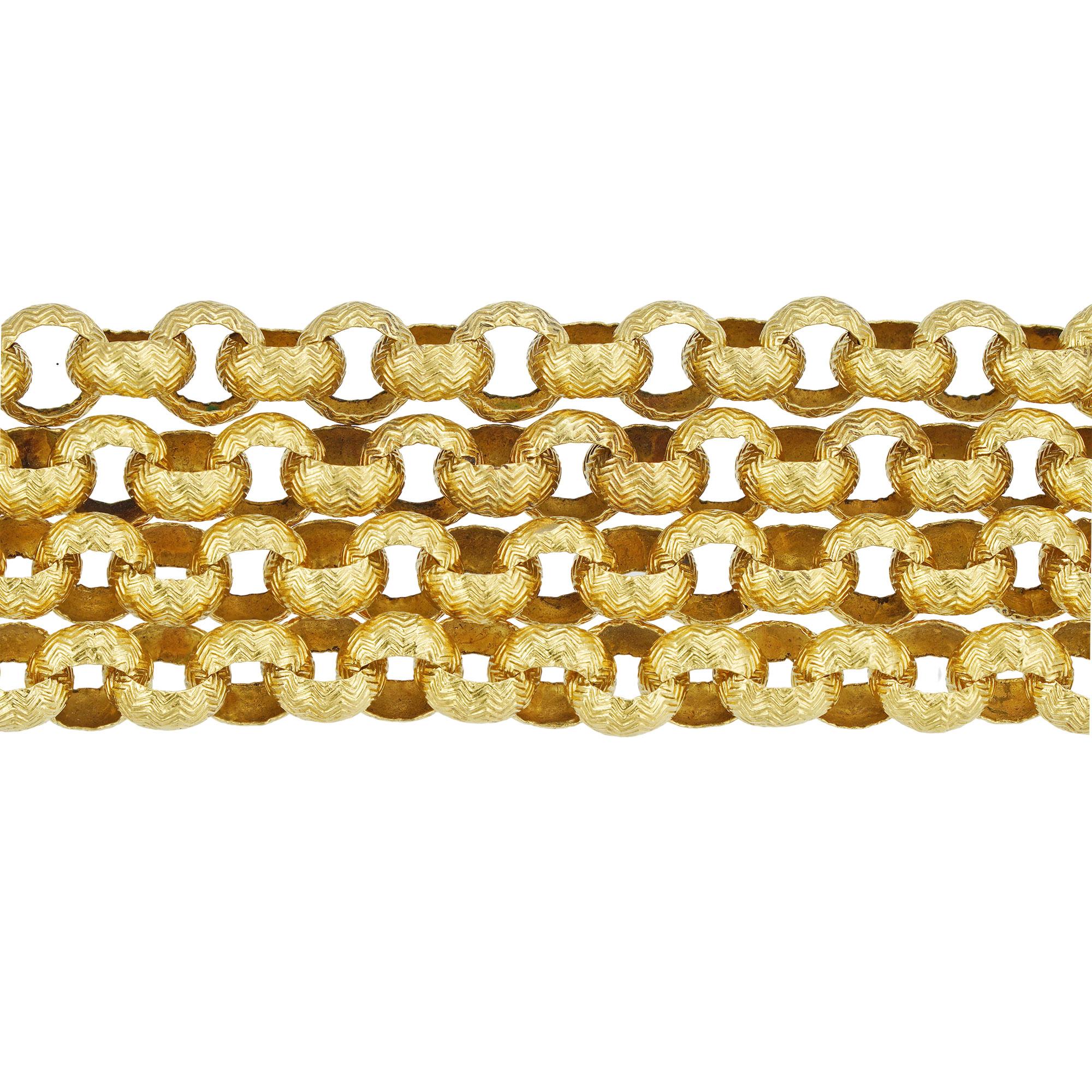 A Victorian gold belcher link guard chain, the open round belcher chain, each link engraved with a chevron pattern, to a barrel push clasp, circa 1860, measuring approximately 100 x 0.6cm, gross weight 32.44 grams.

A Victorian Chain in very good