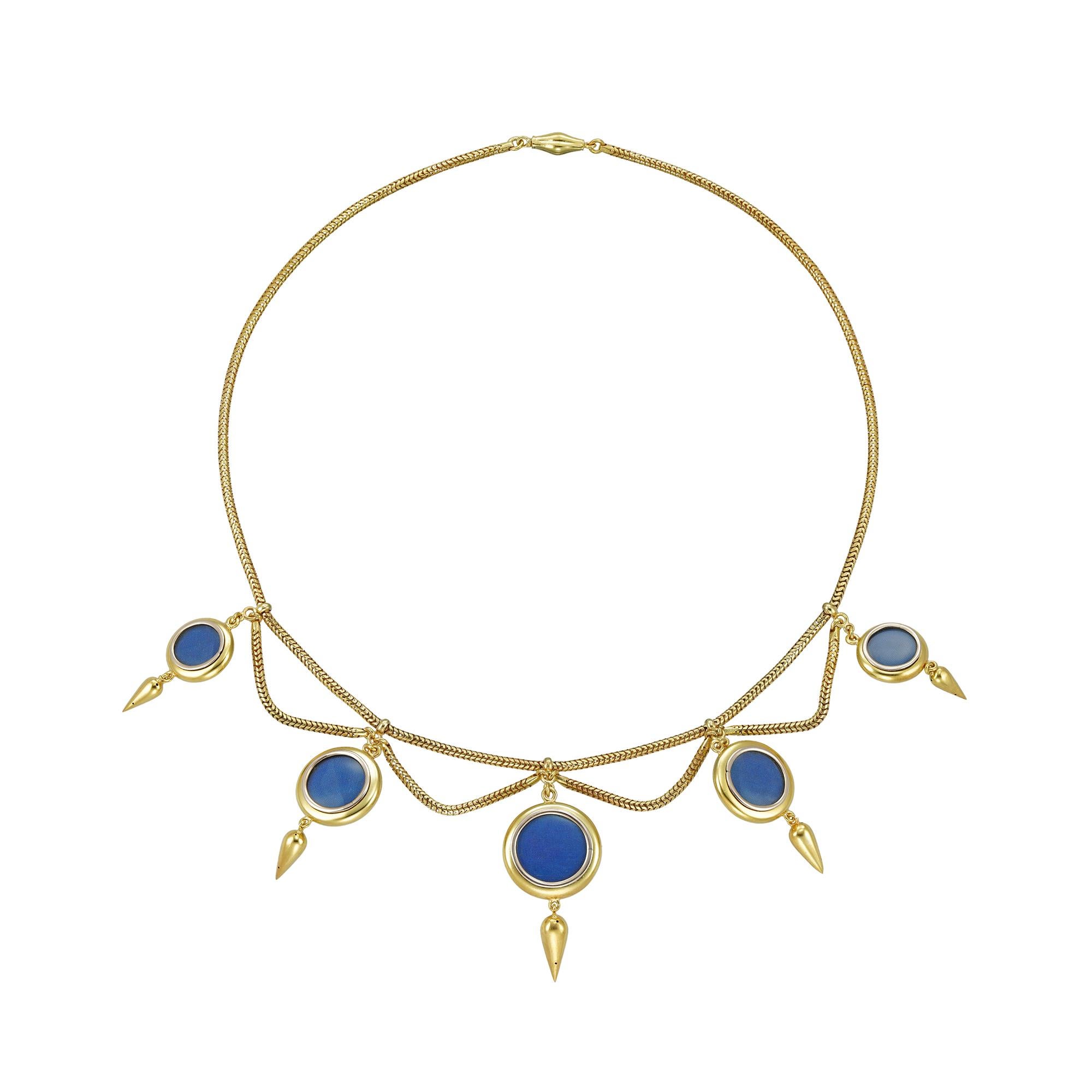 A Victorian gold locket festoon necklace, the five graduated yellow circular lockets each applied to the centre with a pearl within a dark blue enamel star, each having a circular glazed compartment to the reverse and supporting a pipkin drop, all