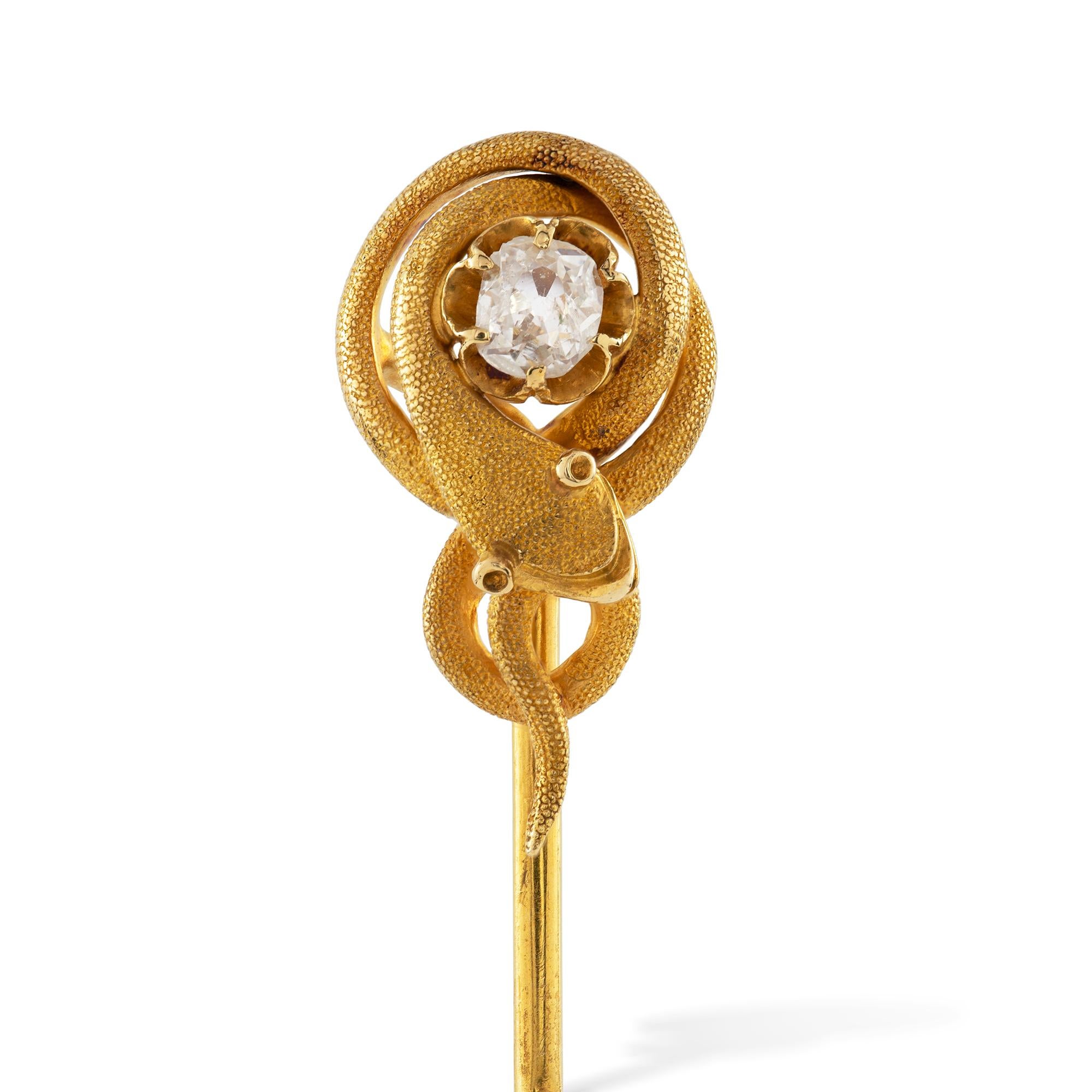 A Victorian snake gold stick-pin, the old European-cut diamond weighing approximately 0.3 carats surrounded by a coiled gold snake with textured finish, all in 18ct gold, to yellow gold stick pin, circa 1880, the jewelled part measuring 2.2cm long,