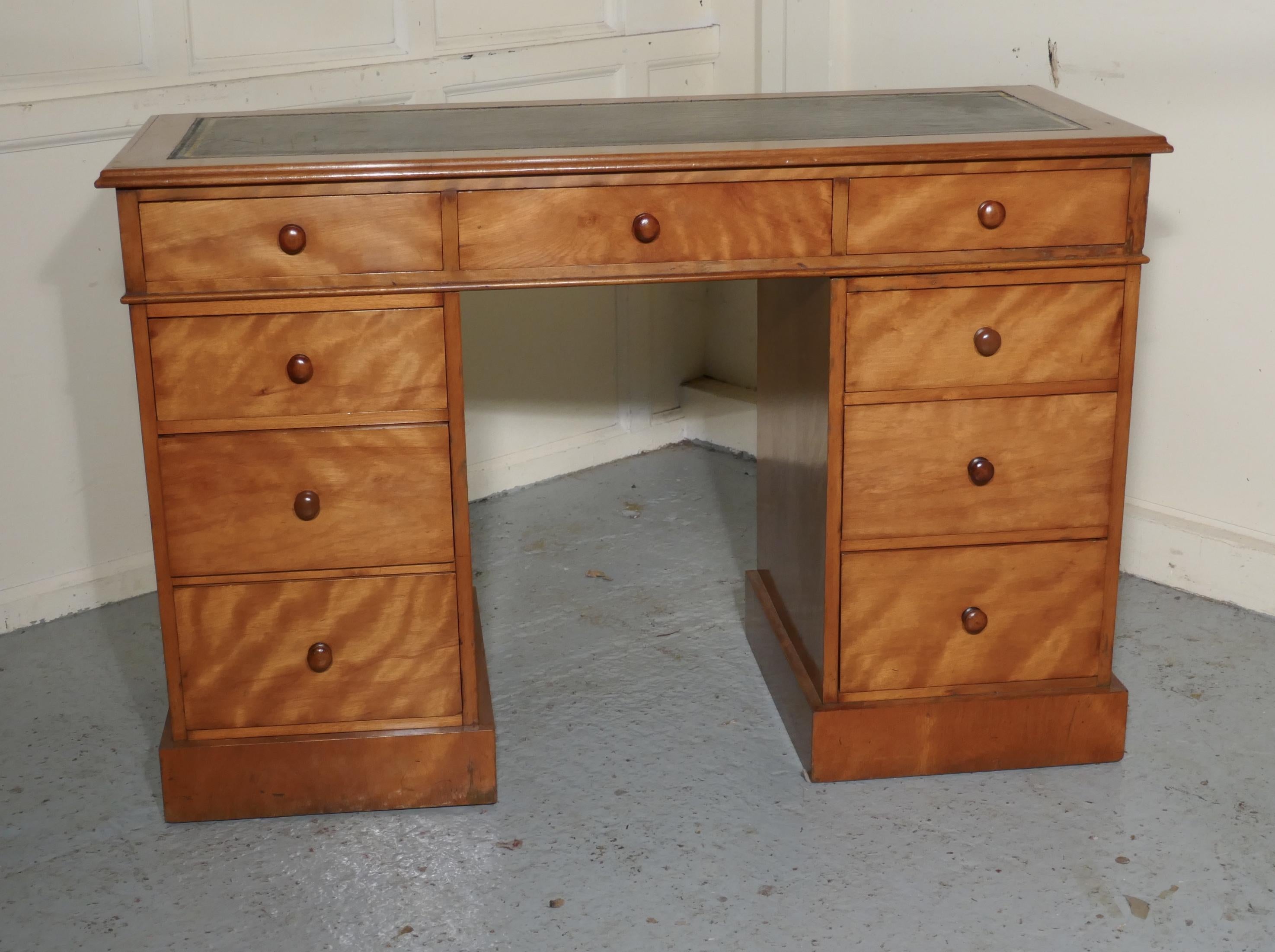A Victorian Good Quality Pedestal Desk 

The desk is made in one of the loveliest woods, figured Birch which has a wonderful dark gold colour, each of the pedestals has three graduated drawers and the top section also has three drawers across the