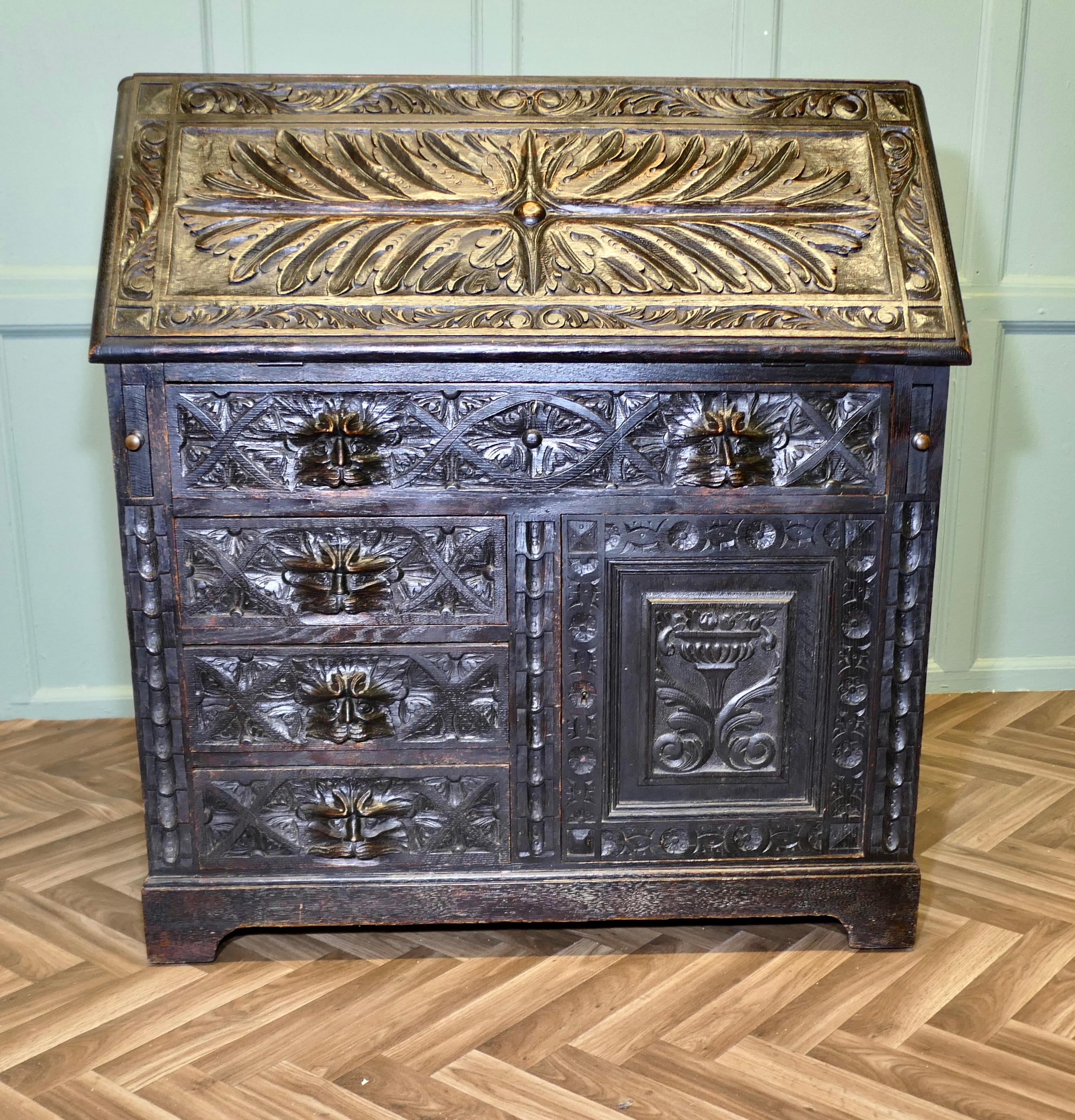 XIXe siècle A Victorian Green Man Carved Oak Bureau   The bureau is superbly carved en vente