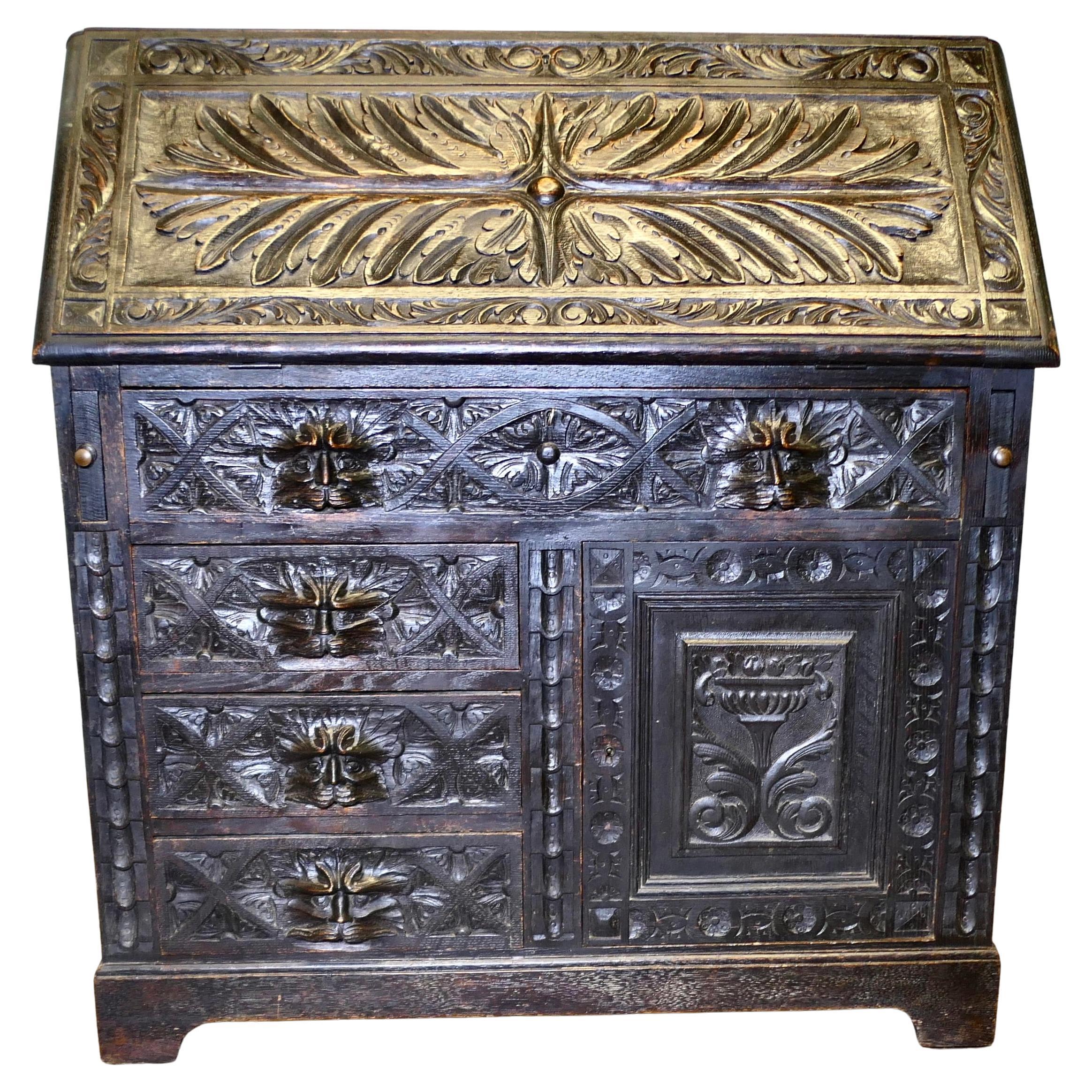 A Victorian Green Man Carved Oak Bureau   The bureau is superbly carved en vente