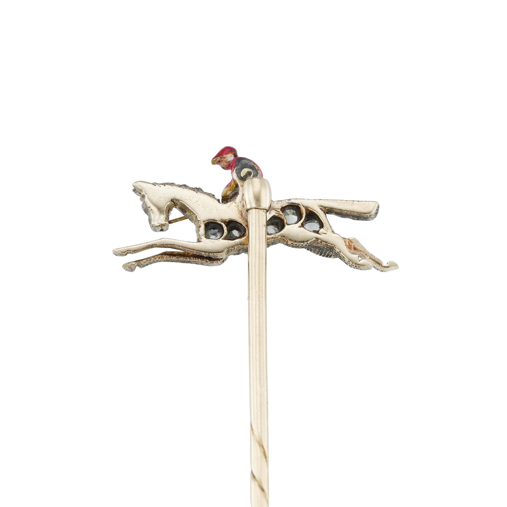 A Victorian horse and jockey stick-pin, the horse set with rose-cut diamonds, the jockey enamelled in white and red, all set in silver and gold, with gold pin fitting, circa 1890, measuring 2.1 x 0.9cm, the pin measuring 6cm long, gross weight 2.5