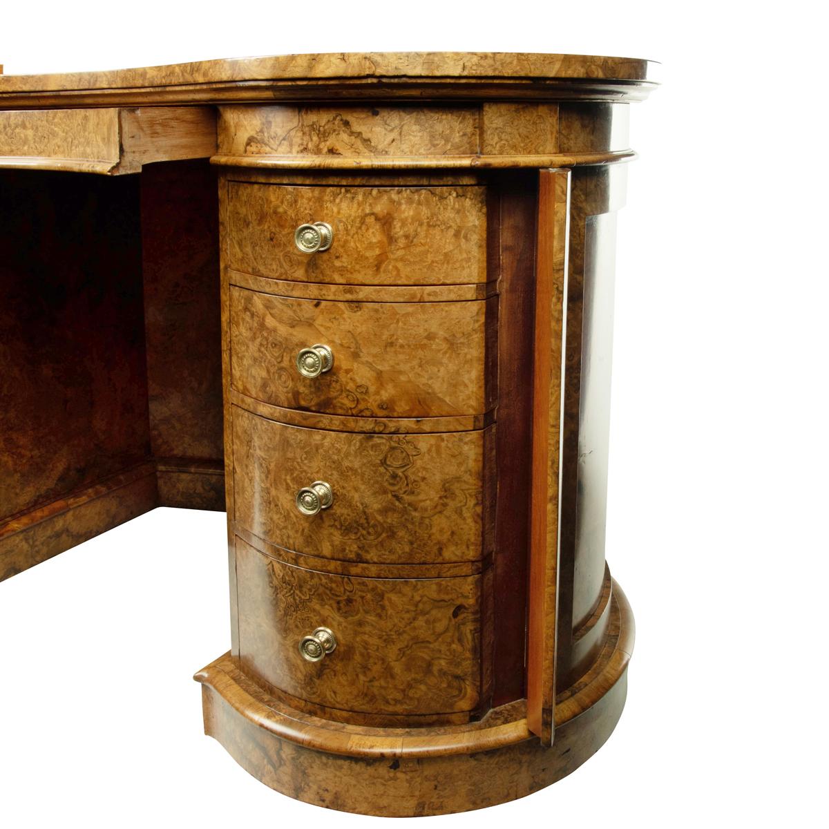 Walnut A Victorian kidney shaped desk in richly figured burr walnut, attributed to Gill For Sale