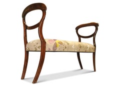 A Victorian Mahogany Balloon Back Window Seat With Floral Upholstery