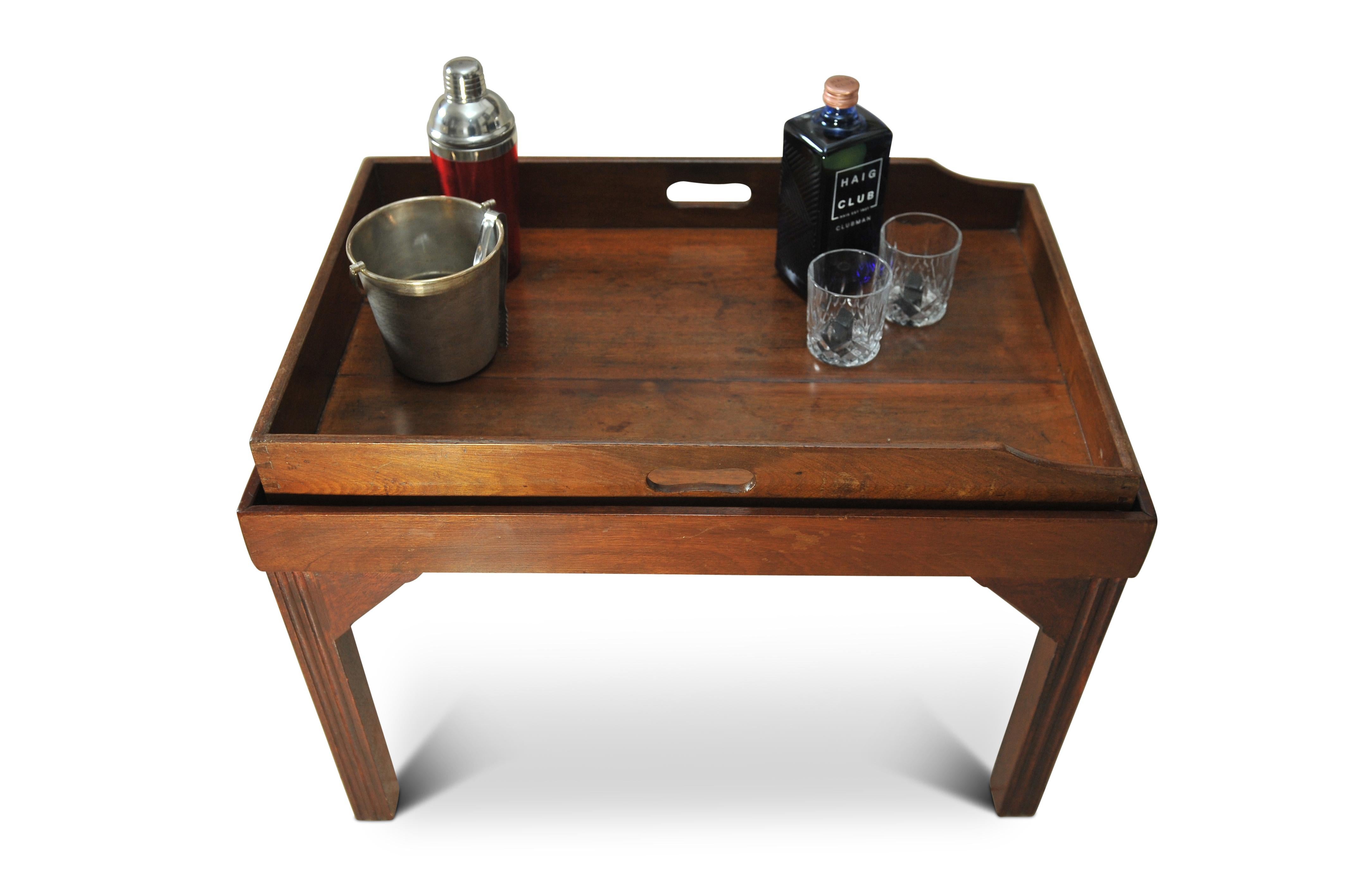 A Victorian Mahogany Butler's Tray With A Later Fixed Coffee Table Stand  Terminating on Block Supports

Removable tray.

