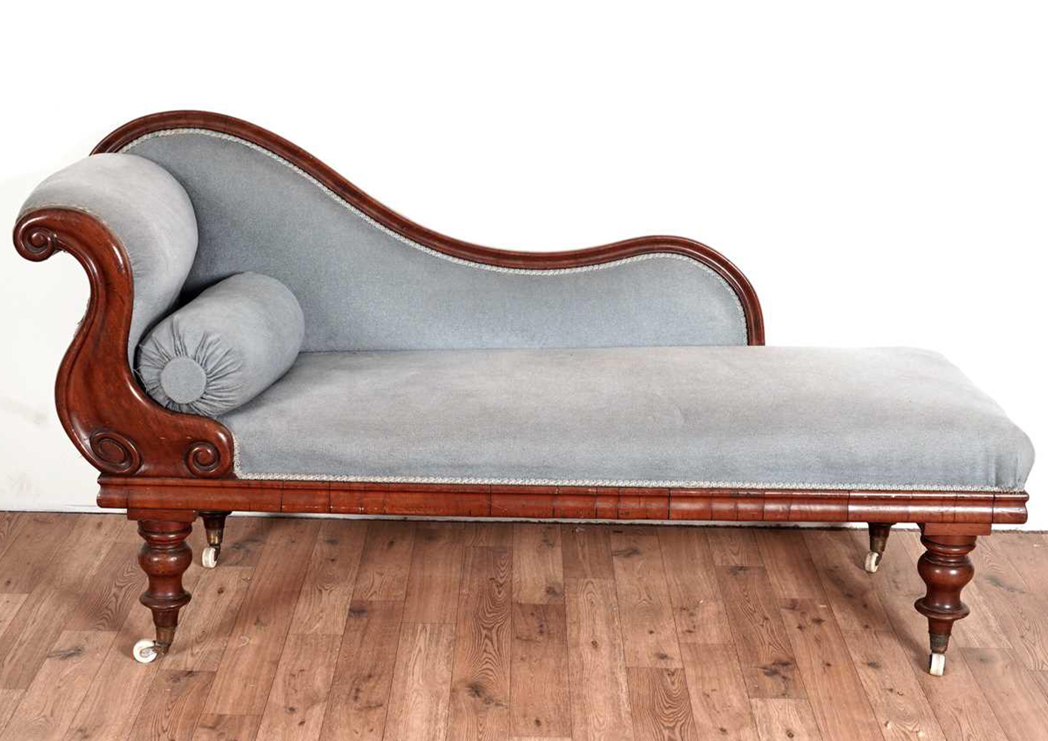 A Victorian Mahogany Swan Back Chaise Longue Day Bed Upholstered in a Duck Egg Blue Plush Fabric With A Carved Scroll End Back Rest. Brass Terminating Turned Legs on Original White Ceramic Castors.

